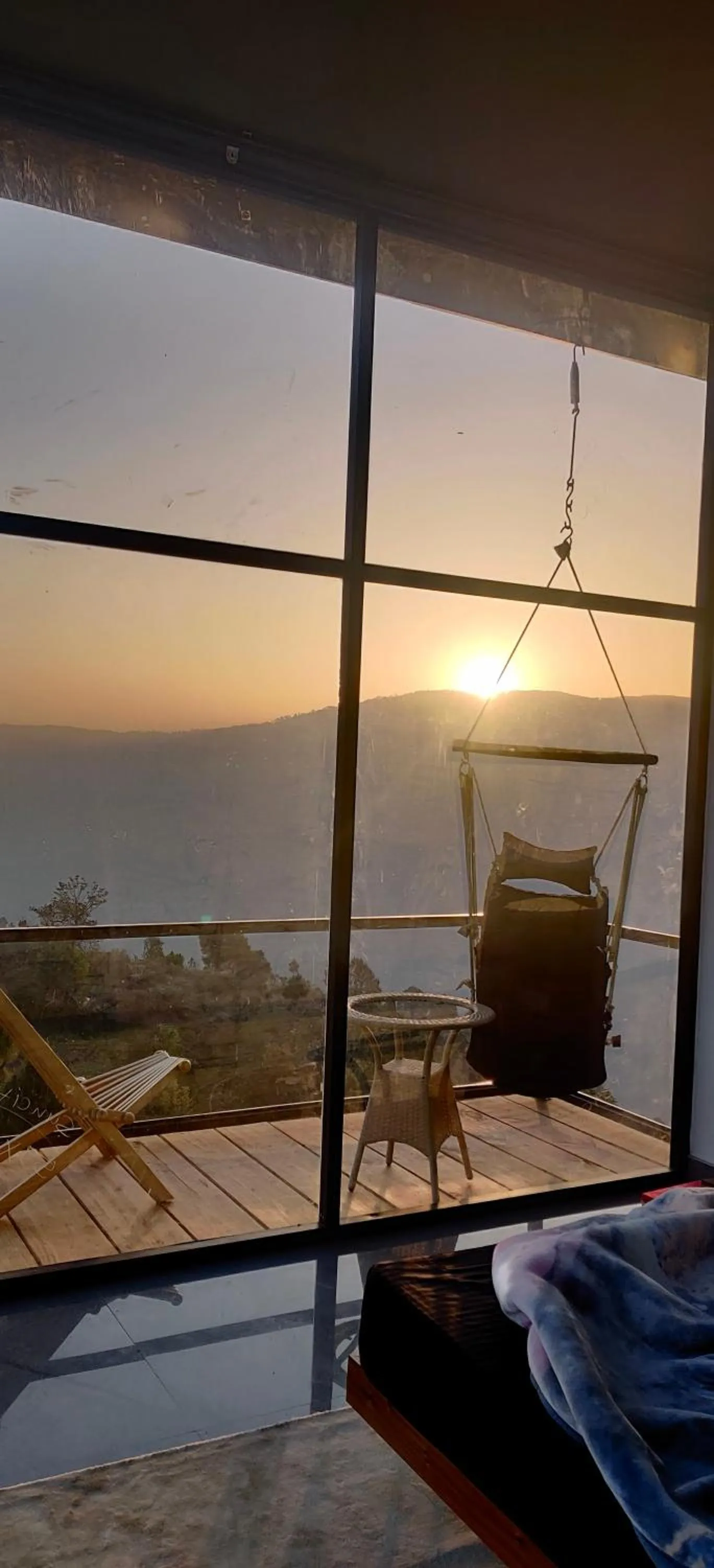 Seating area in SaffronStays Glasshouse Celeste, Ranikhet - luxurious glass villa with breathtaking views