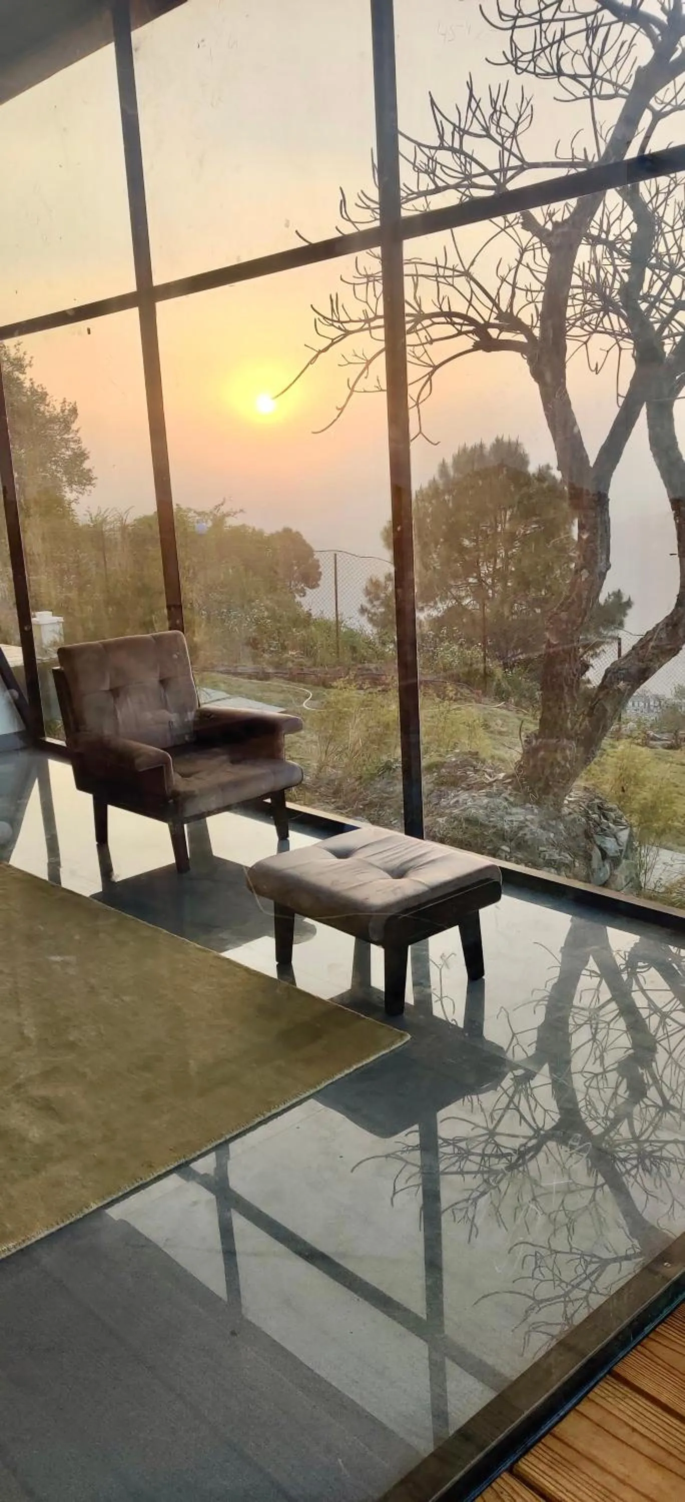 Seating area in SaffronStays Glasshouse Celeste, Ranikhet - luxurious glass villa with breathtaking views
