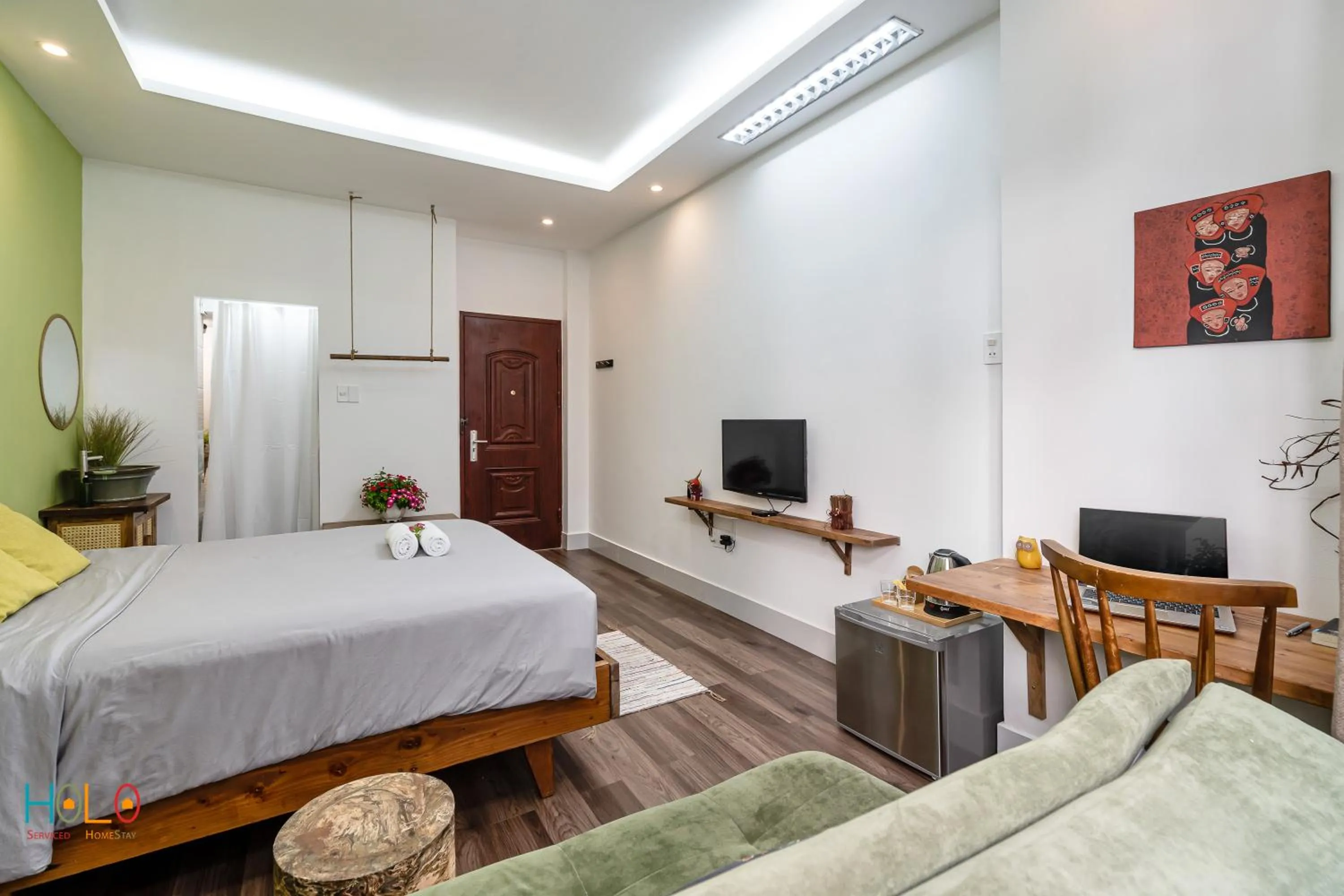 TV and multimedia, Bed in HoLo Central Saigon - Serviced HomeStay