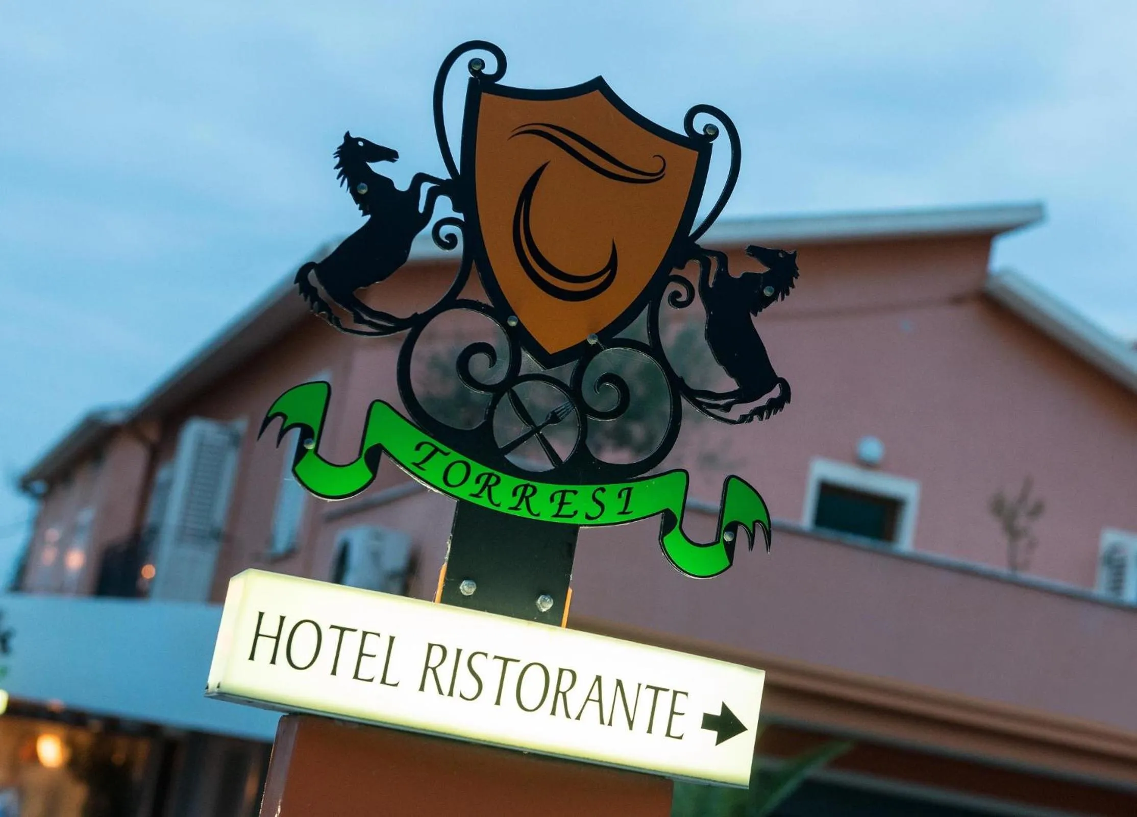 Property logo or sign in Hotel Torresi