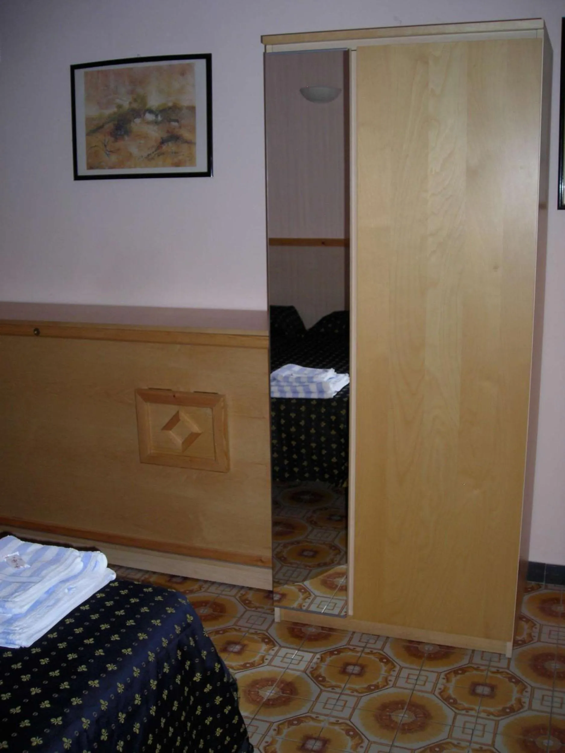 Decorative detail, Bed in Hotel Delle Mimose