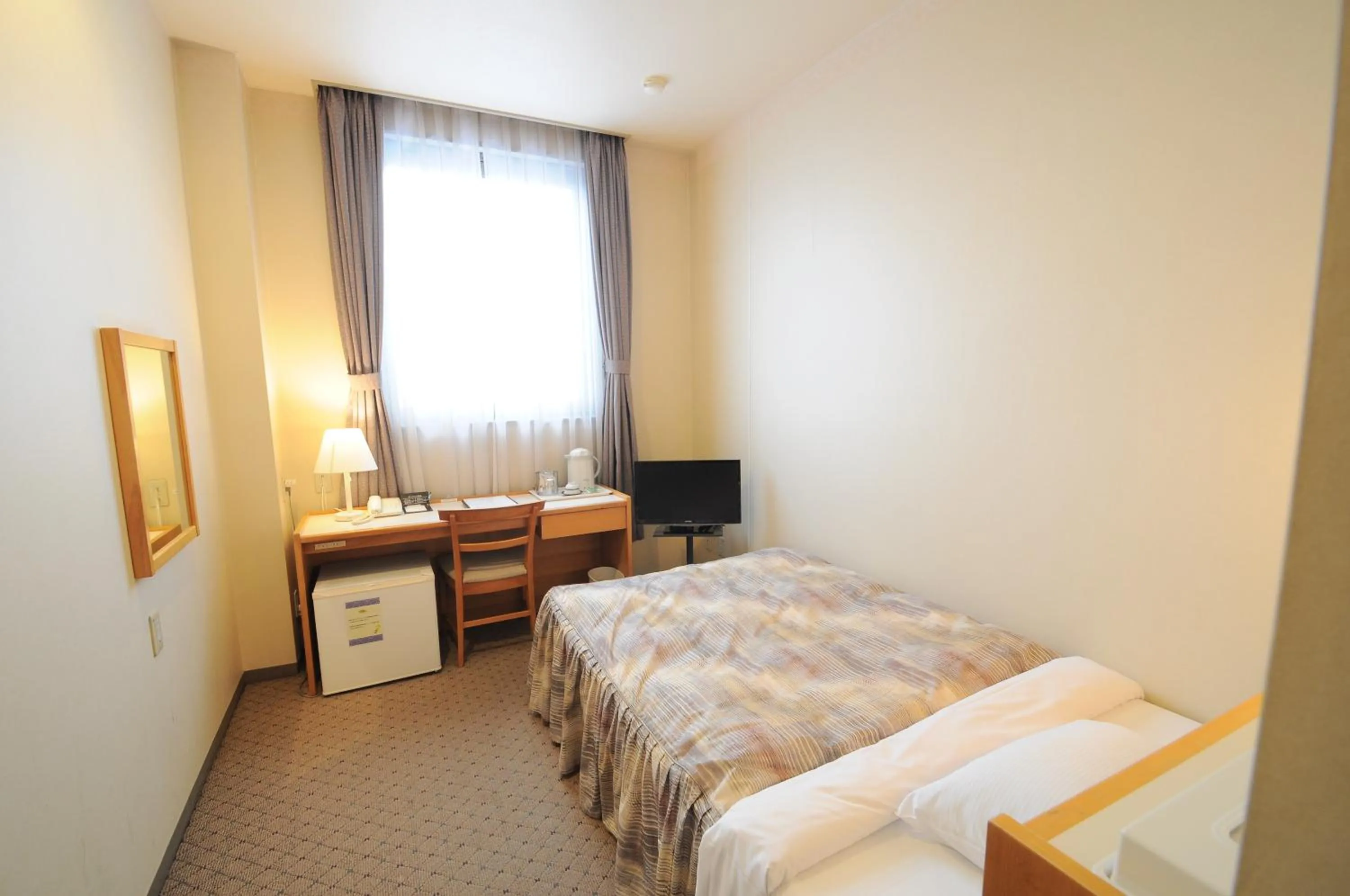 Photo of the whole room, Bed in Hotel Sapporo Sun Plaza
