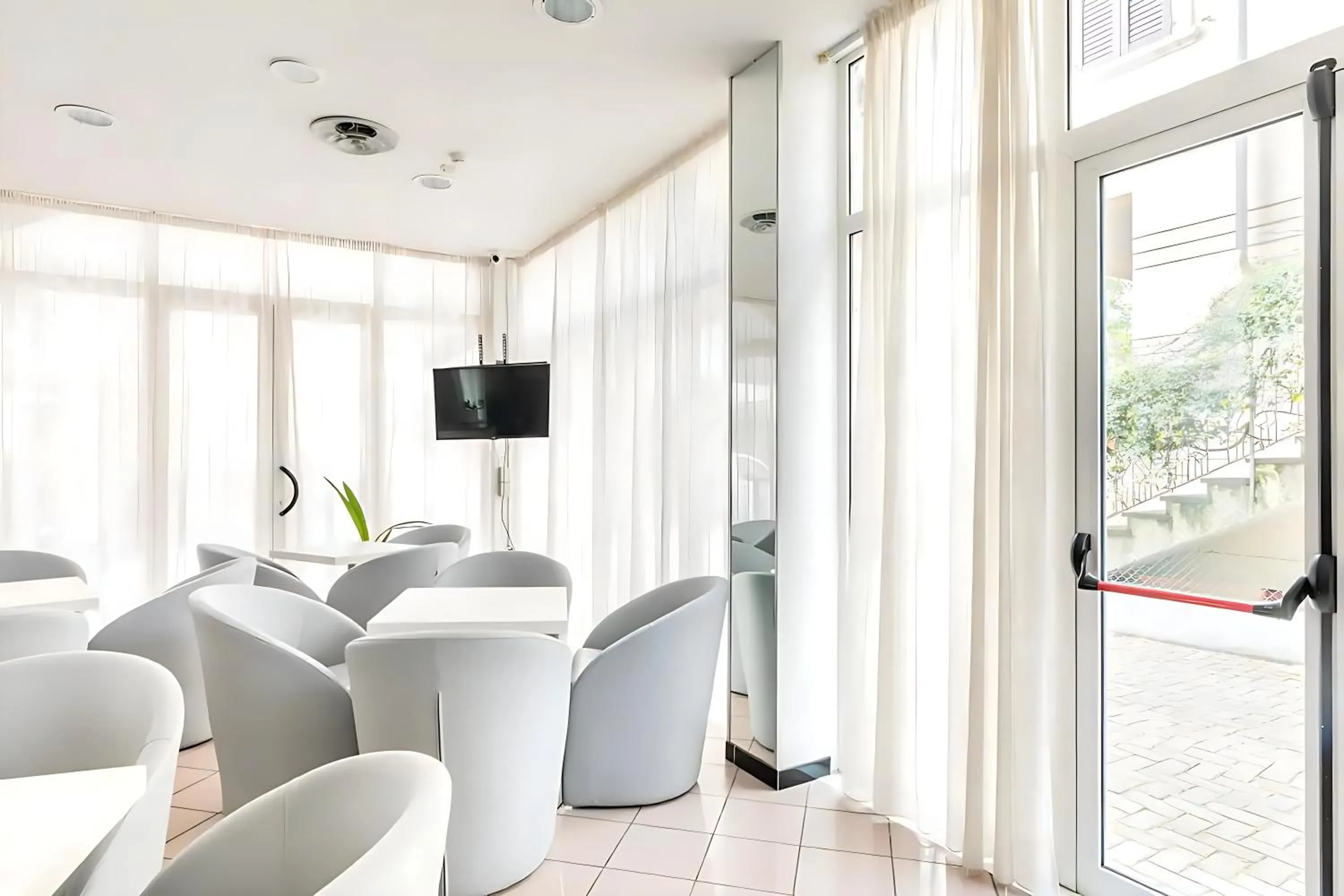 Communal lounge/ TV room in Hotel Villa Argia Rimini Marina Centro