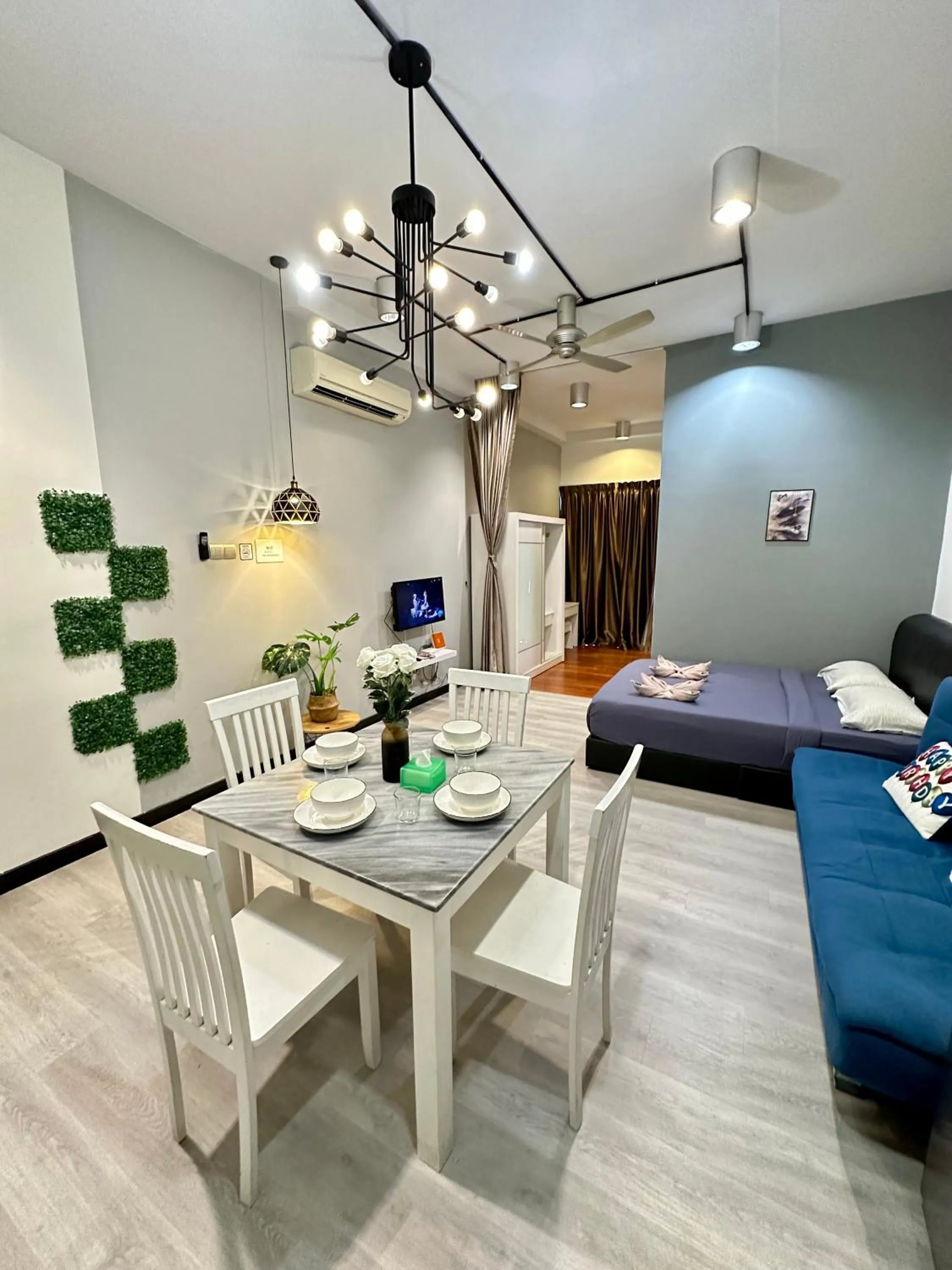 Communal lounge/ TV room, Bed in AJ Suites @ Loft Imago KK