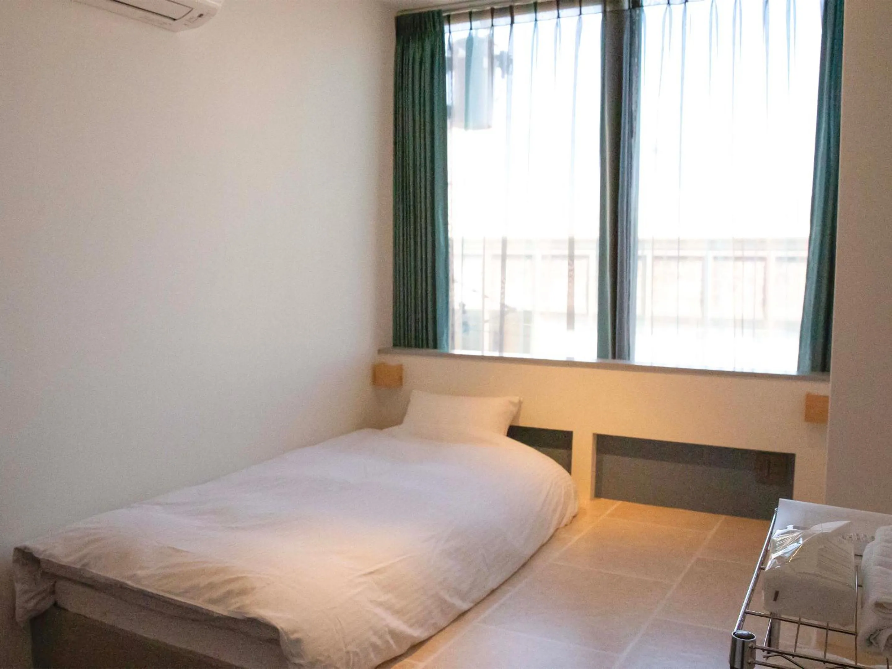 Photo of the whole room, Bed in the circle apartment