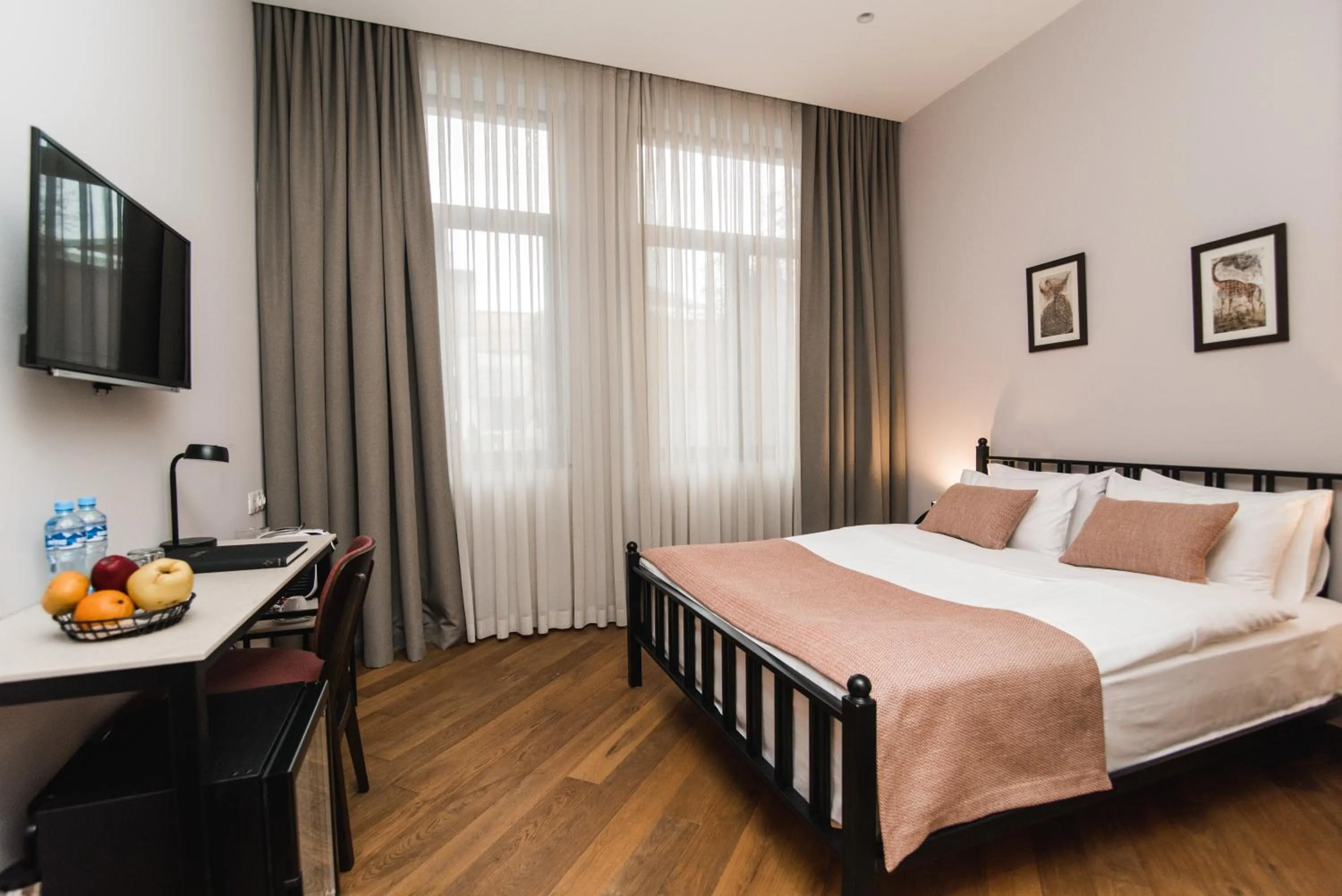 Photo of the whole room, Bed in Makmani Boutique Hotel by DNT Group