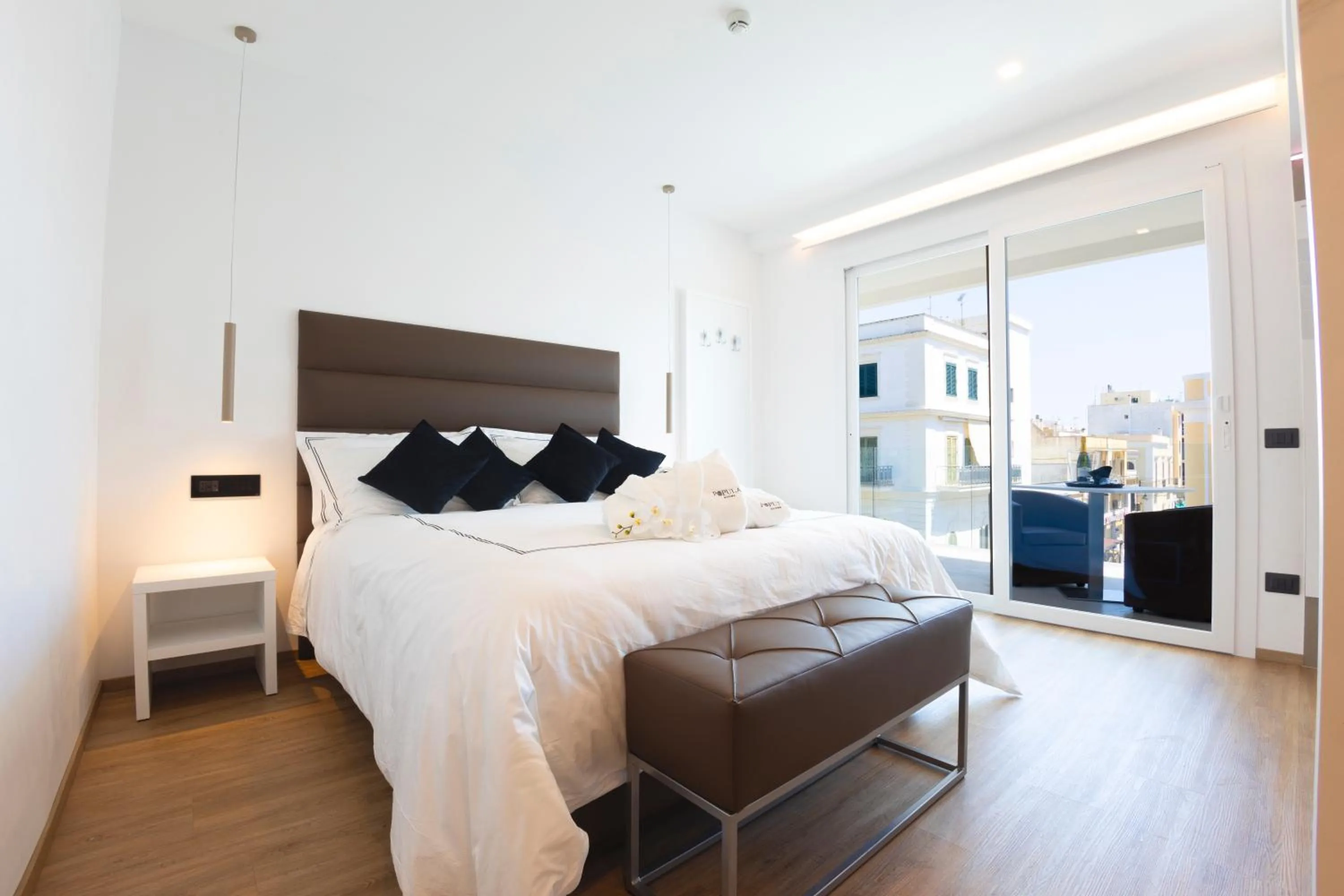 Bed in Popula Rooms & Mediterranean Bay