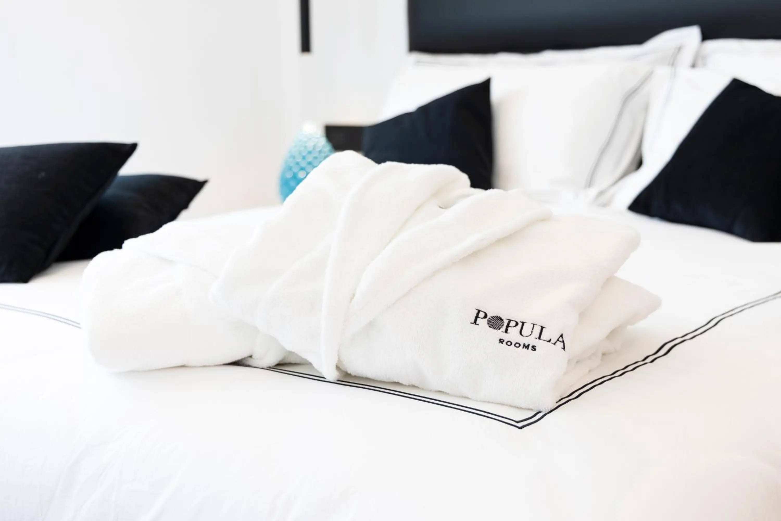 Bed in Popula Rooms & Mediterranean Bay