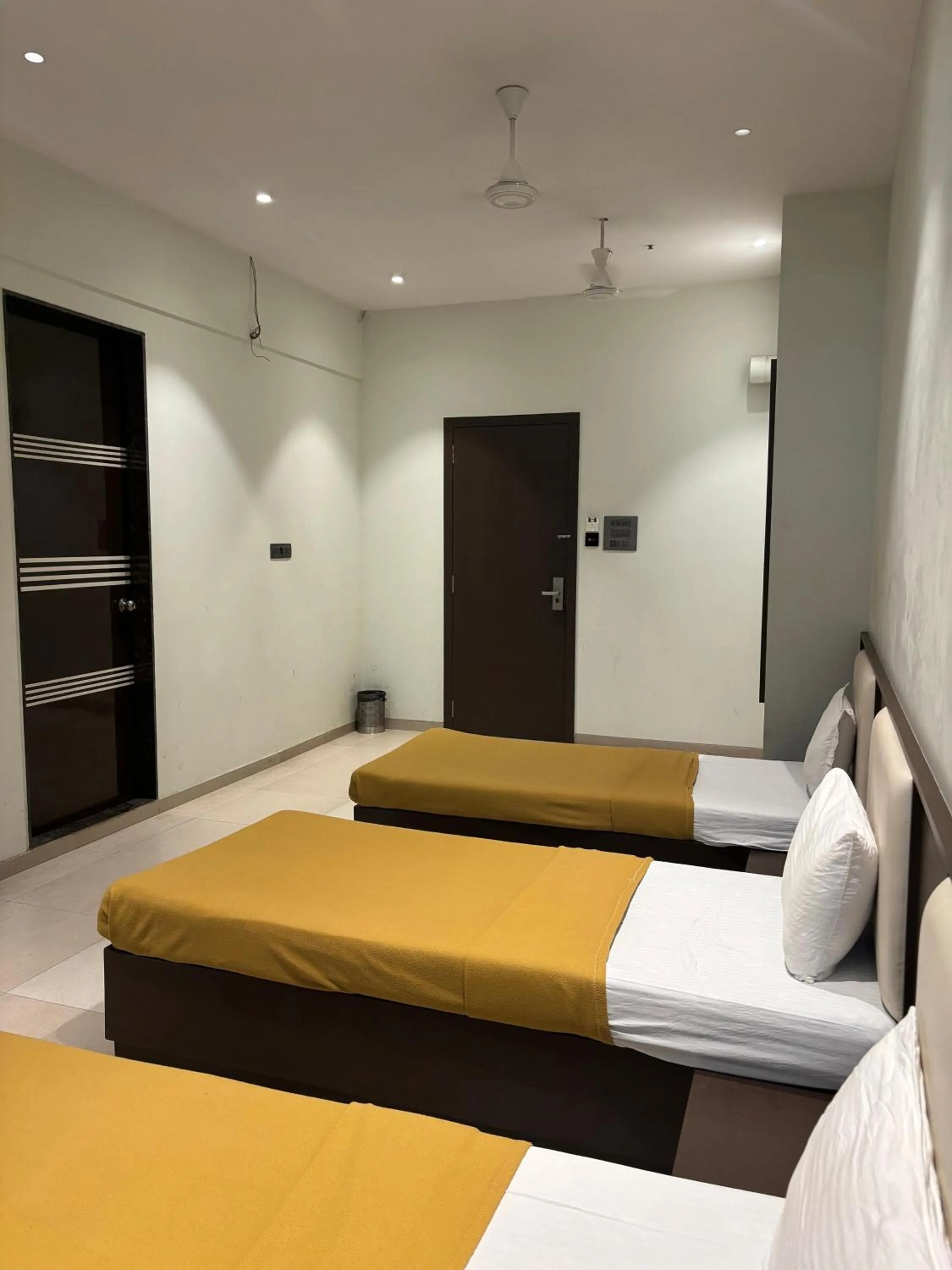 Bed in VISHRAM EXECUTIVE ROOMS