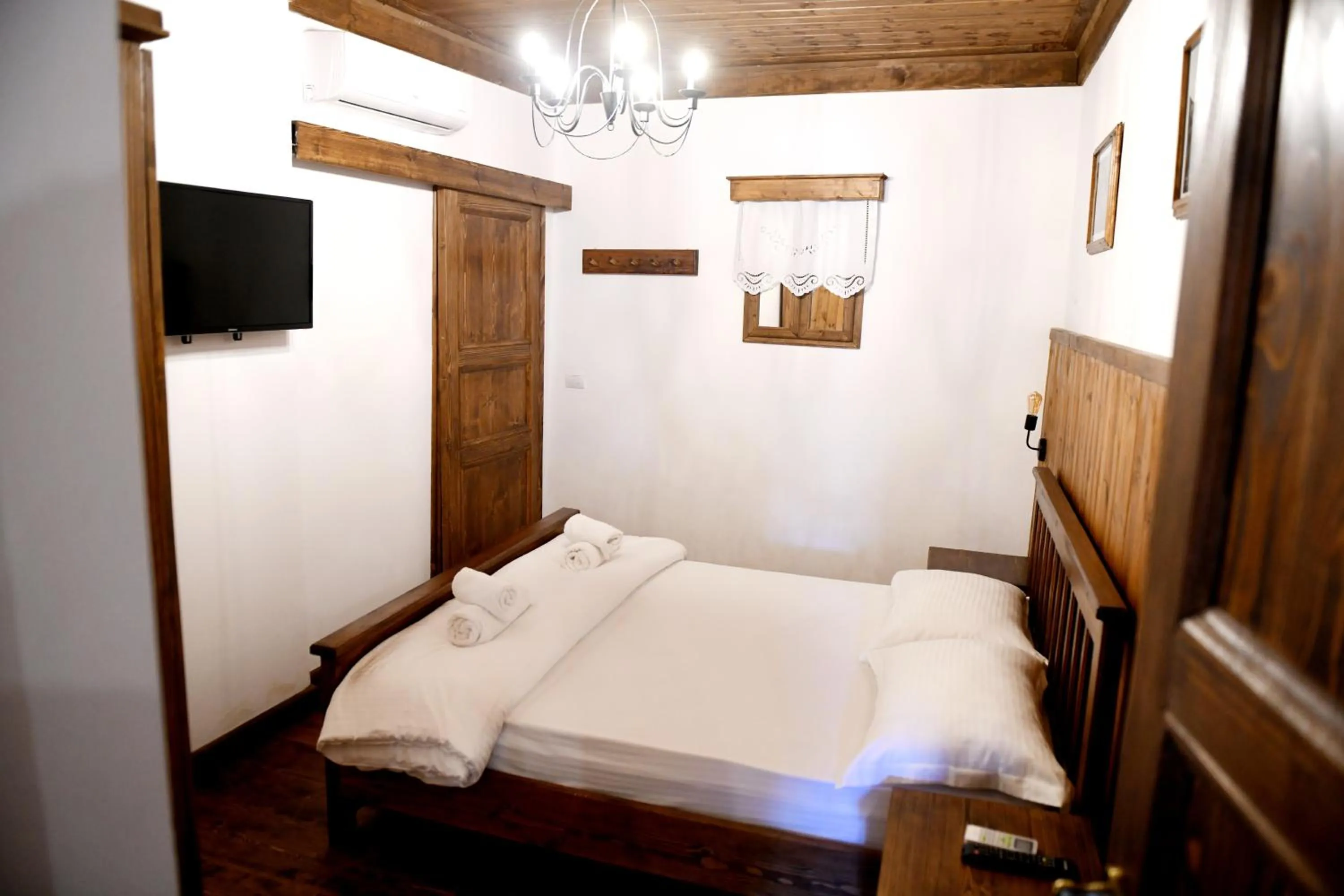 Communal lounge/ TV room, Bed in Anhel Hotel