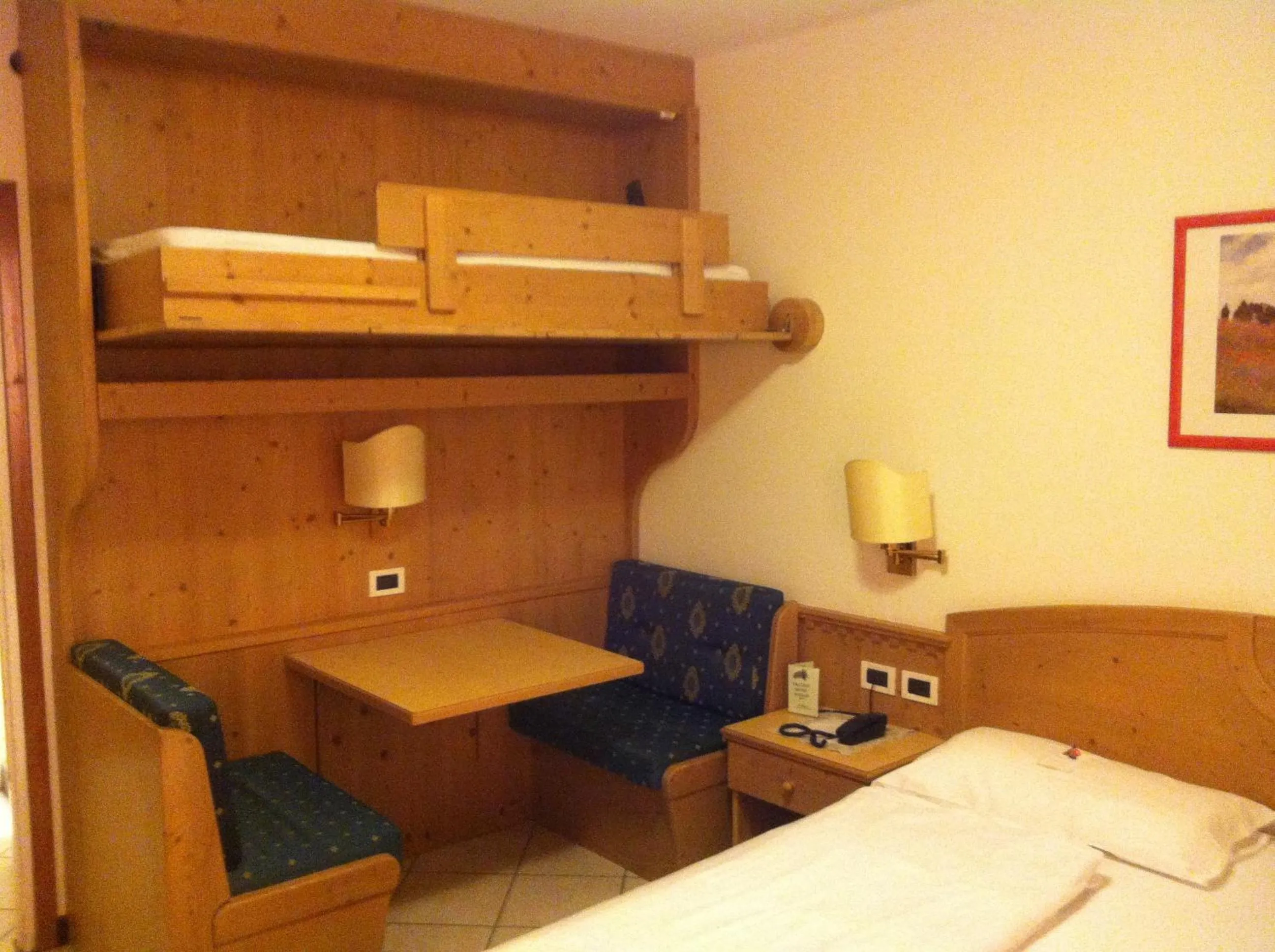 Seating area, Bed in Piccolo Hotel Sciliar