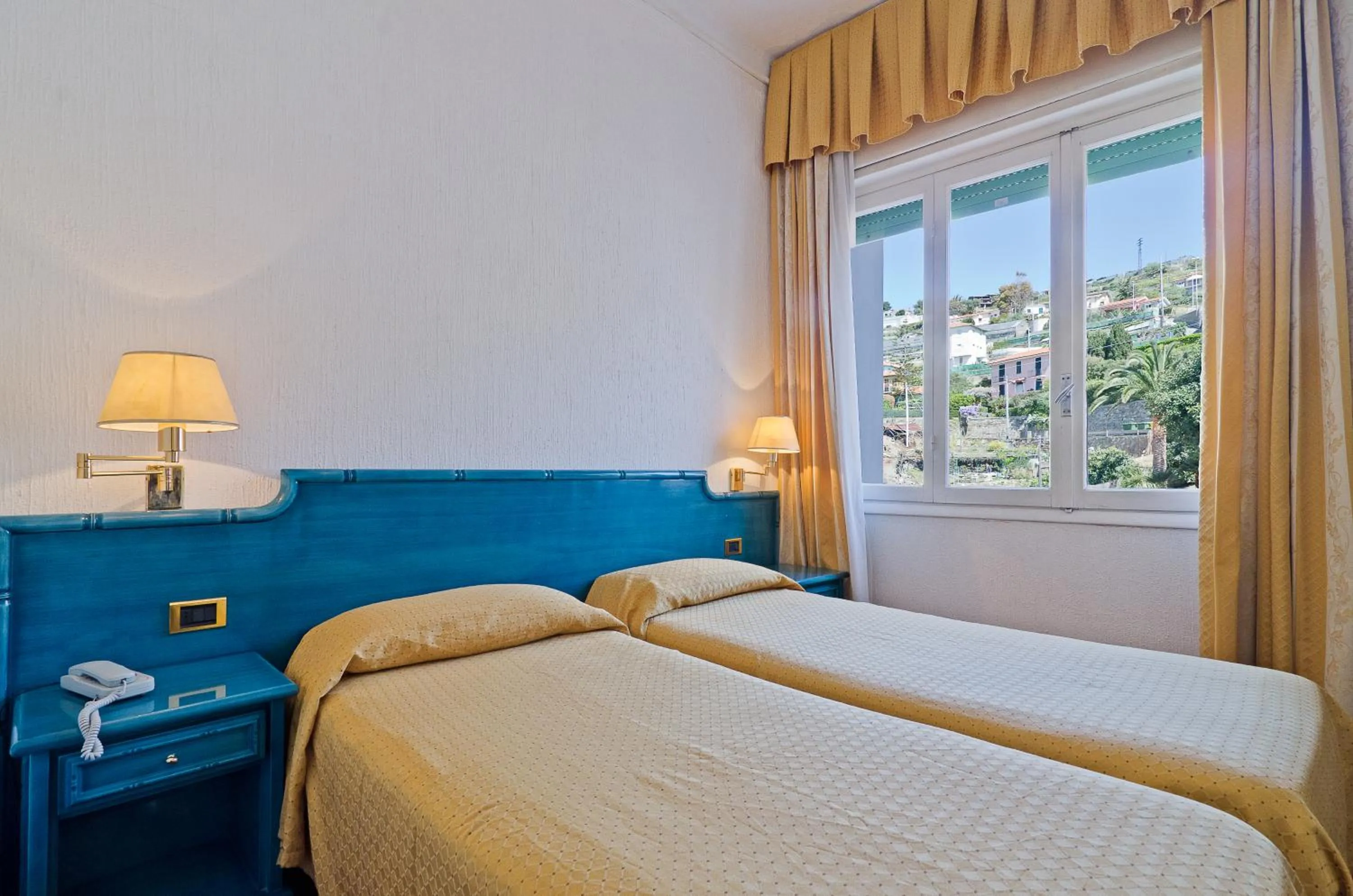 Bed in Hotel Ariston Montecarlo