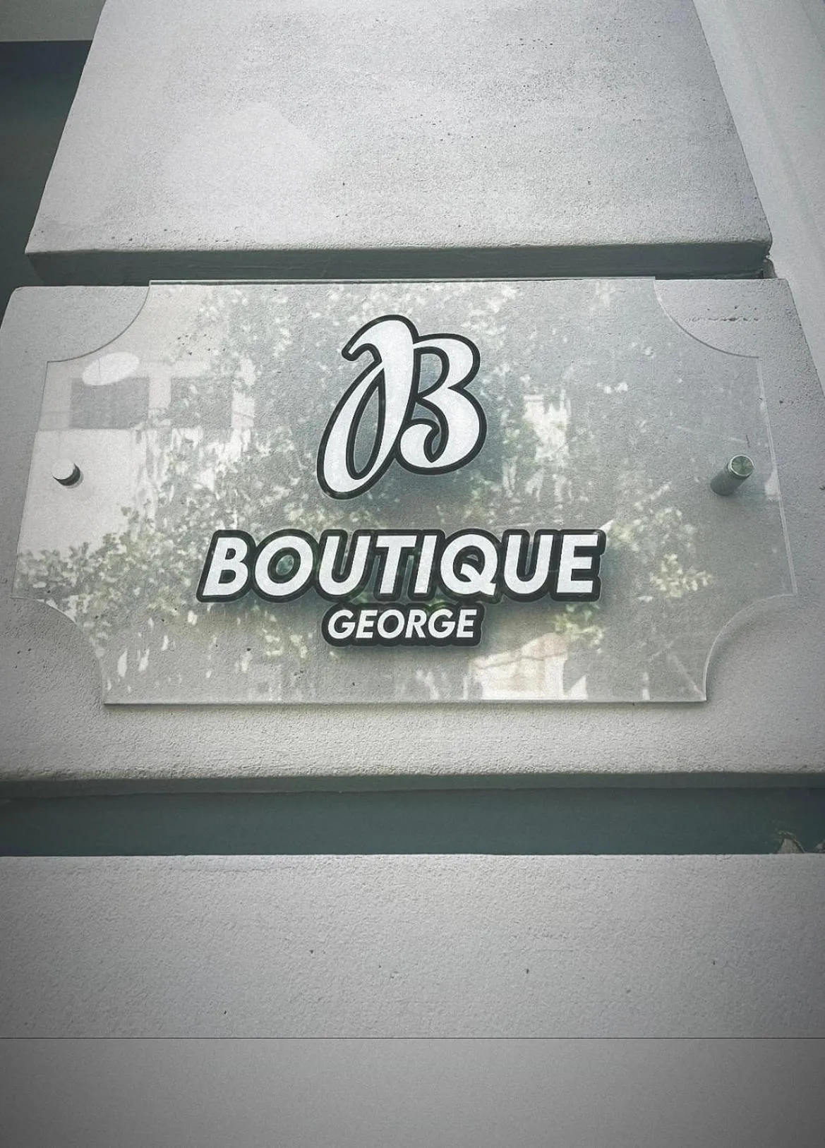 Property logo or sign in Hotel Boutique George