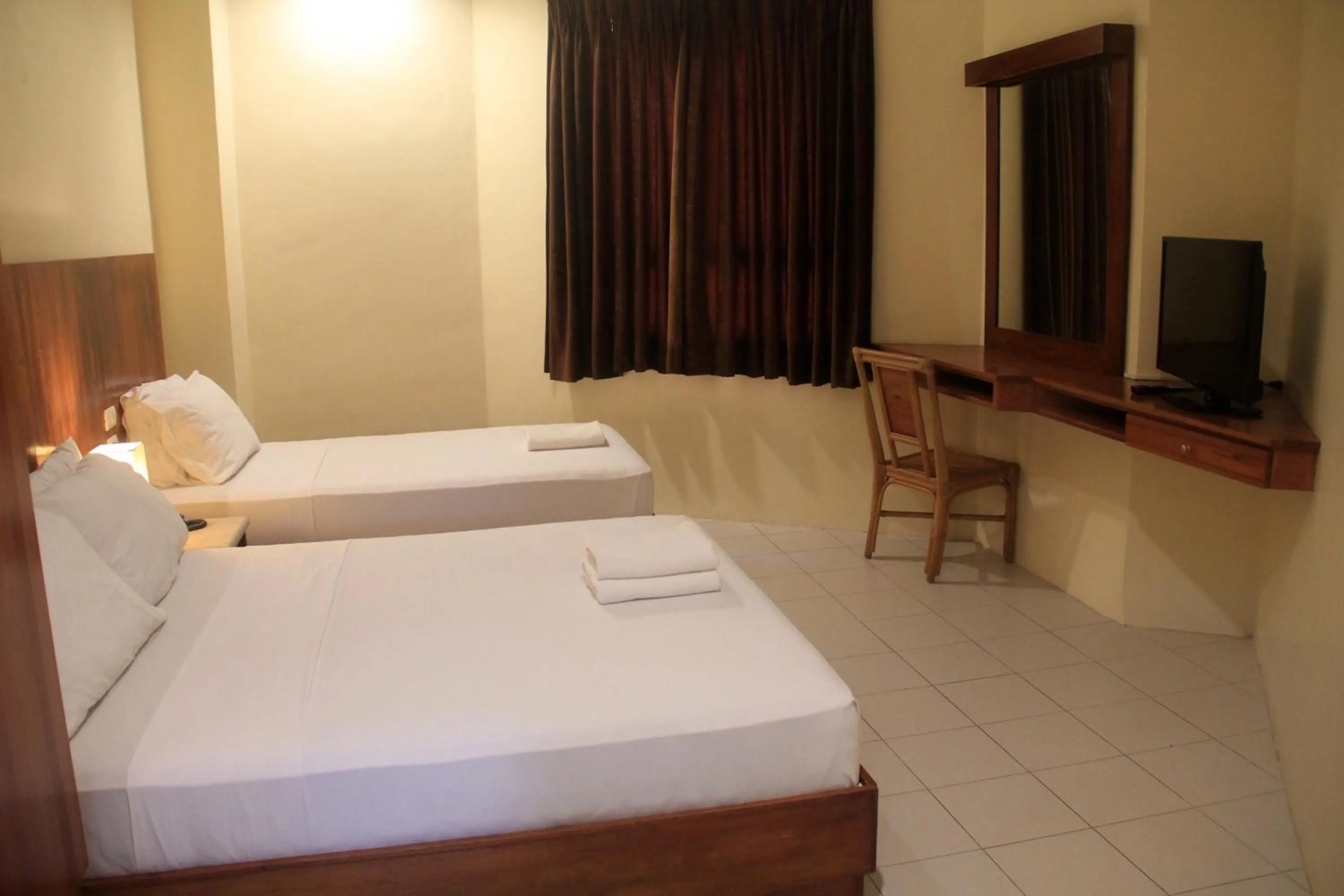 Bed in Tsai Hotel and Residences