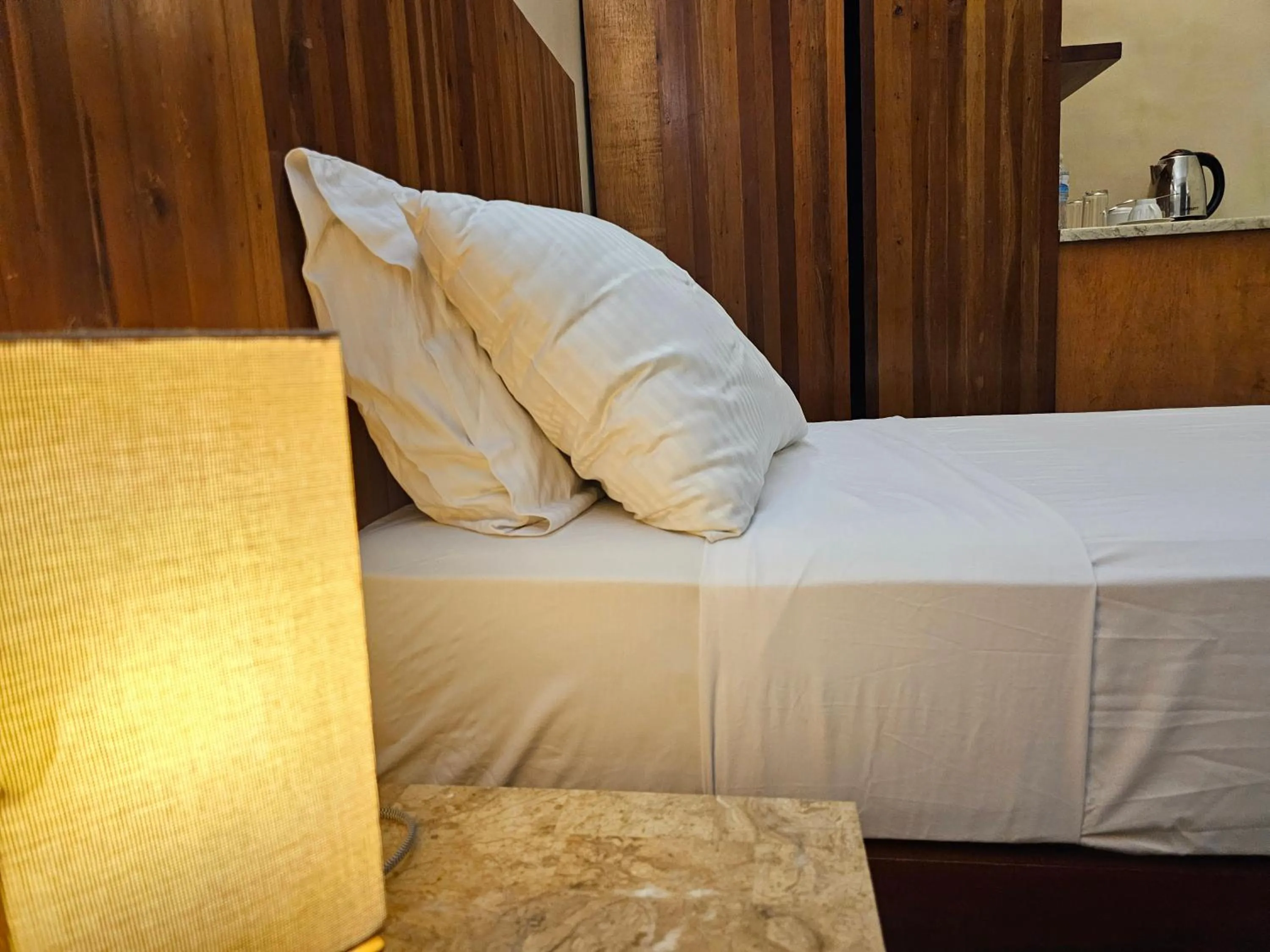 Bed in Tsai Hotel and Residences