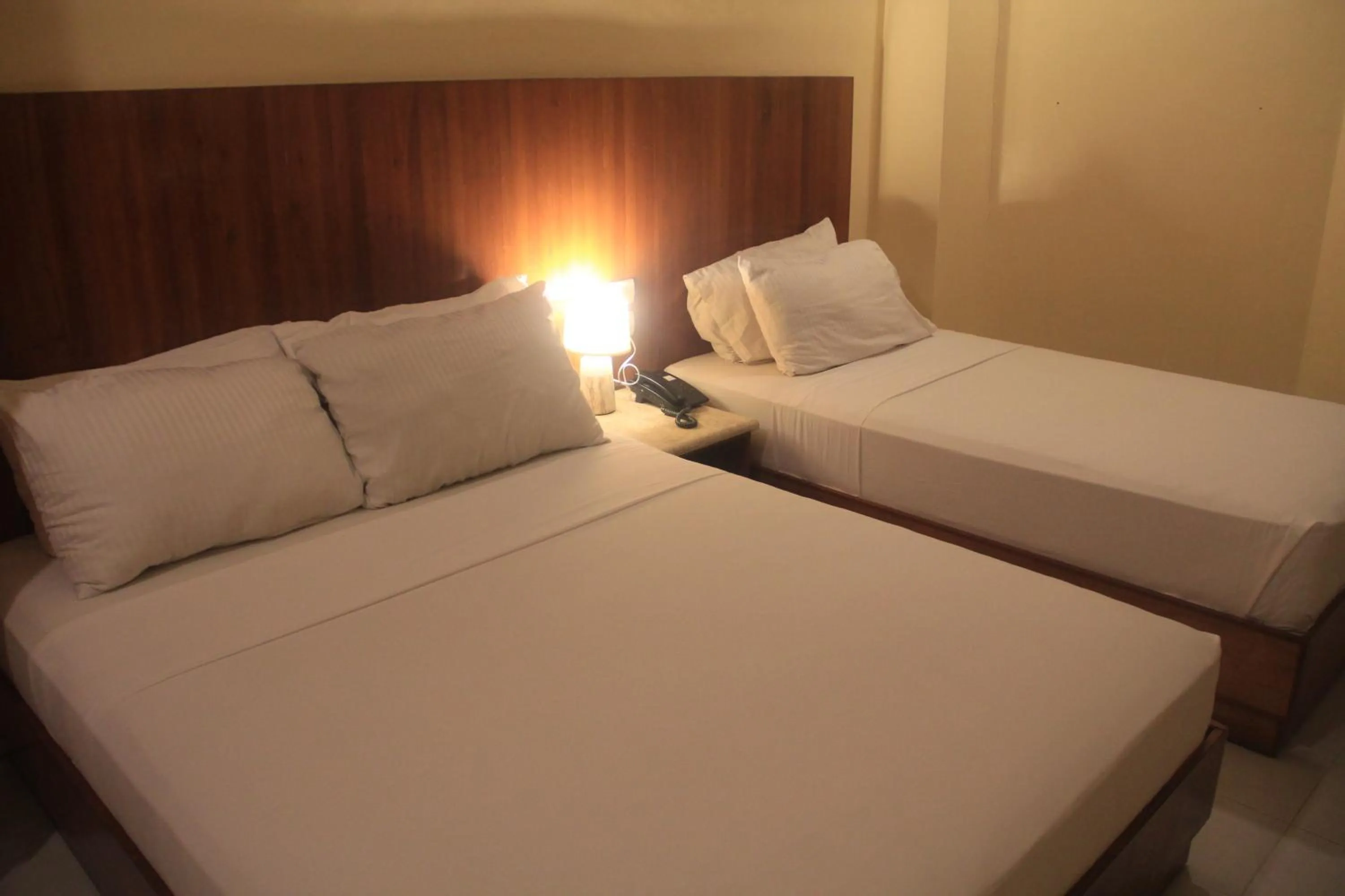 Bed in Tsai Hotel and Residences