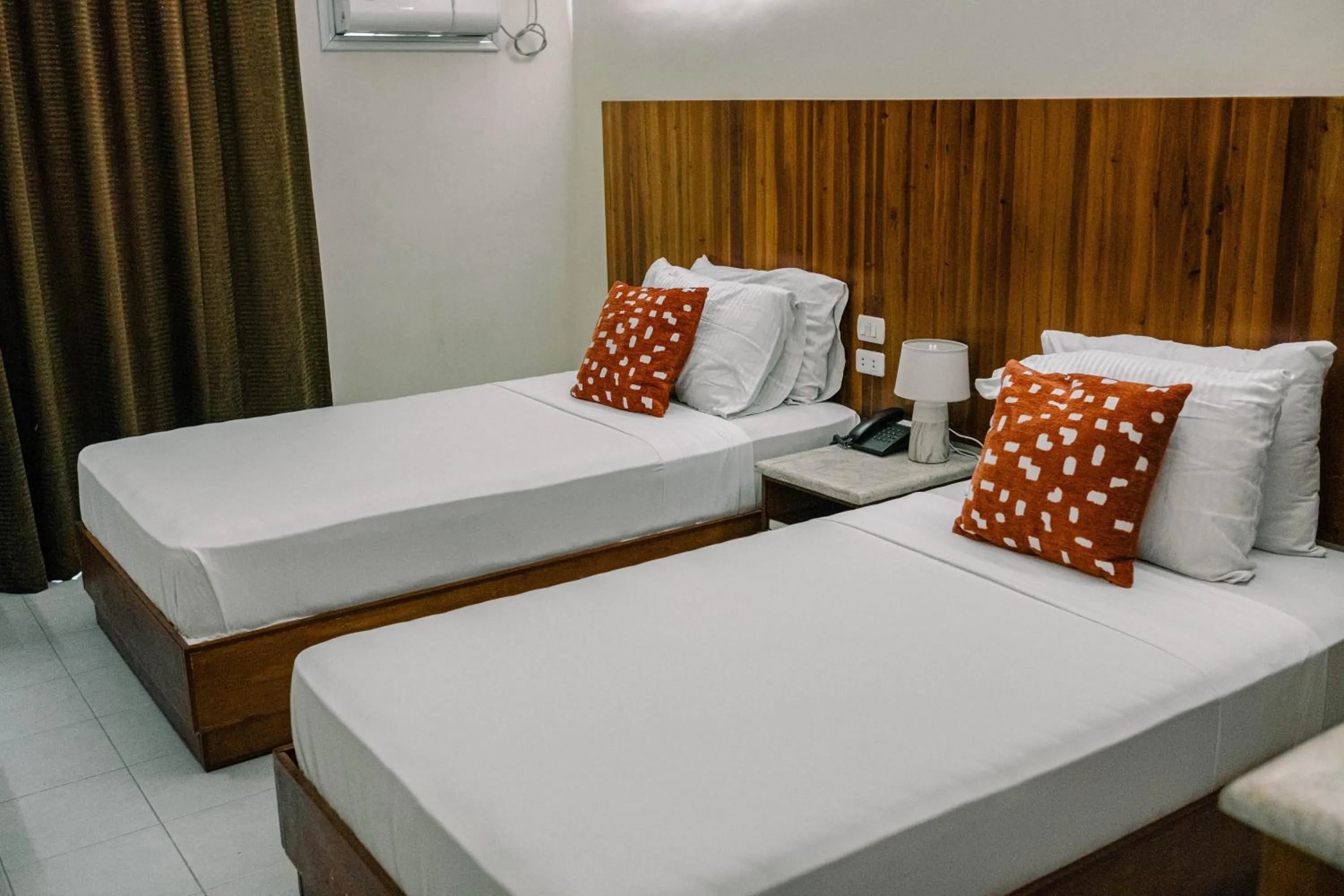 Bed in Tsai Hotel and Residences