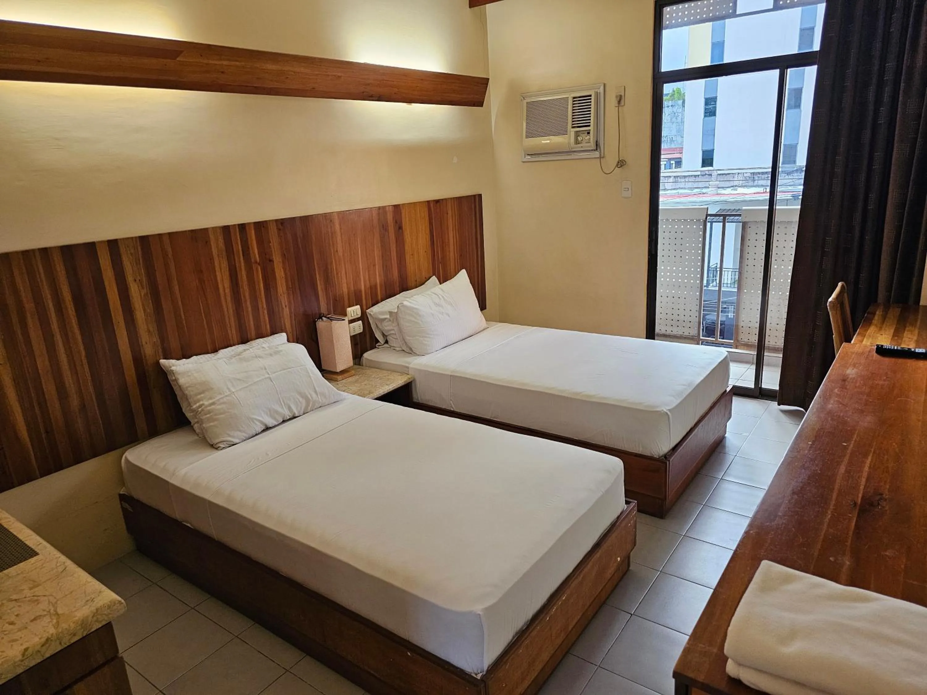 Bed in Tsai Hotel and Residences