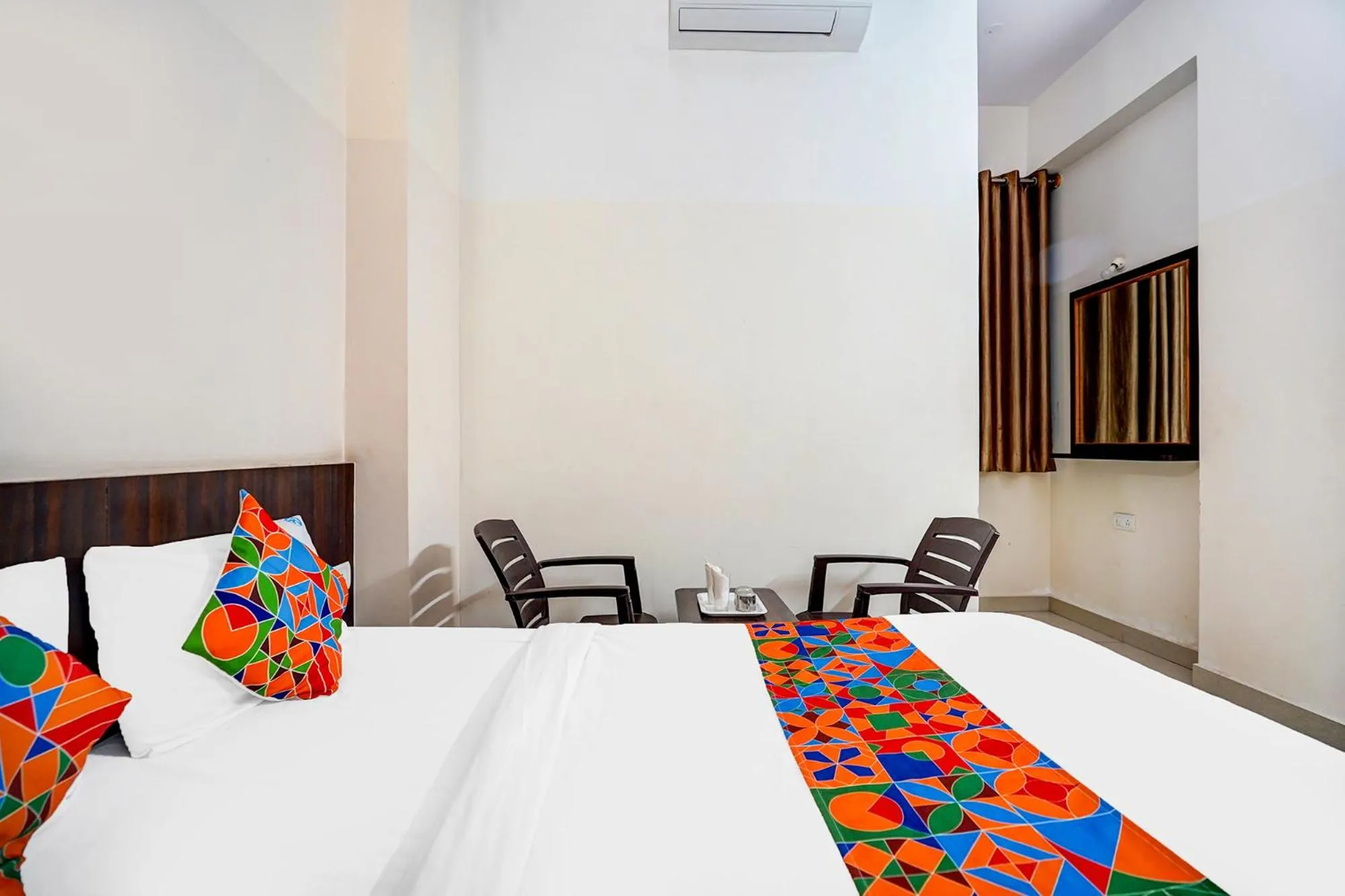 Bed in FabHotel Pride Image - Rajarajeshwari Nagar