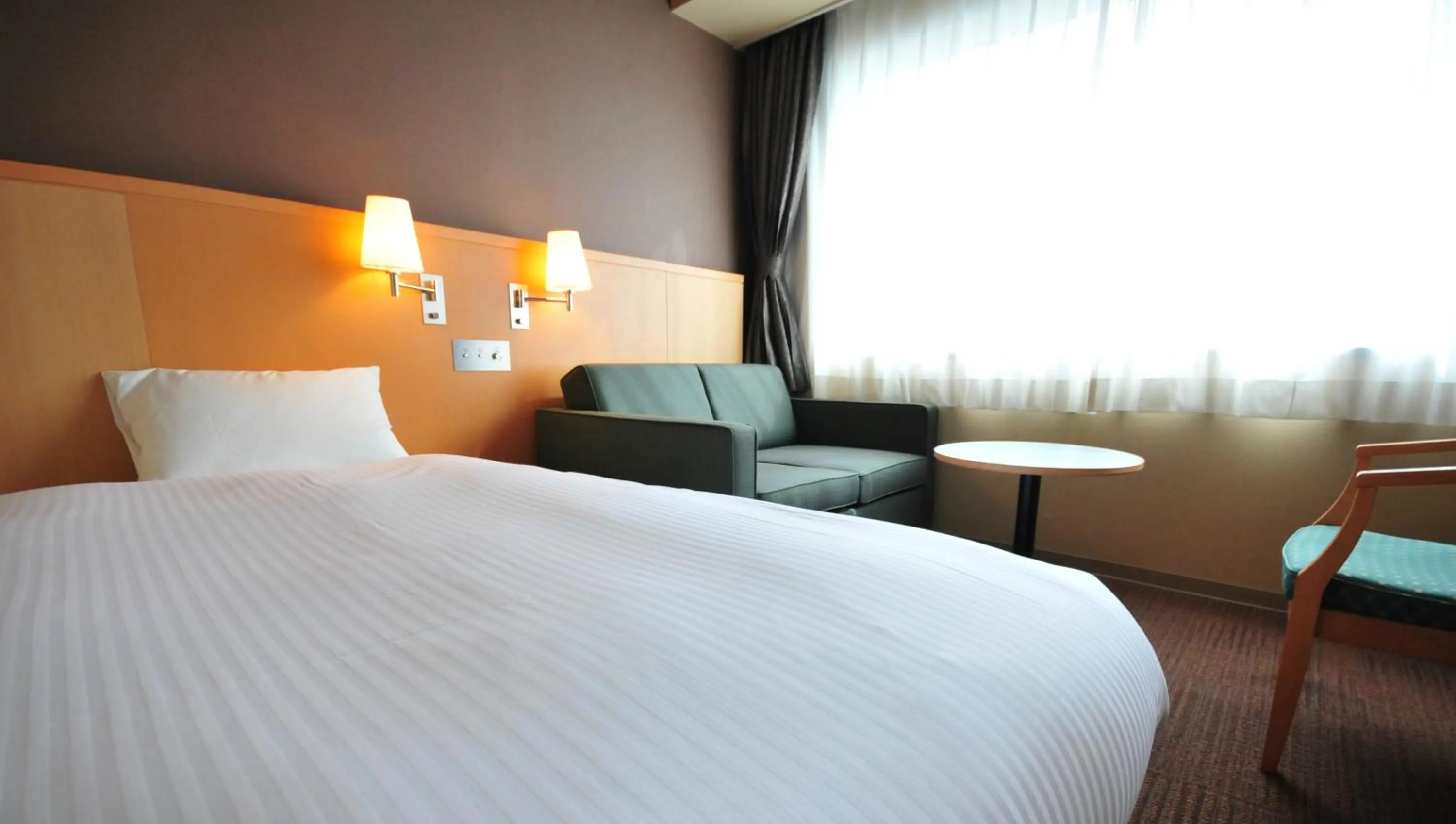 Seating area, Bed in Hotel Premium Green Hills