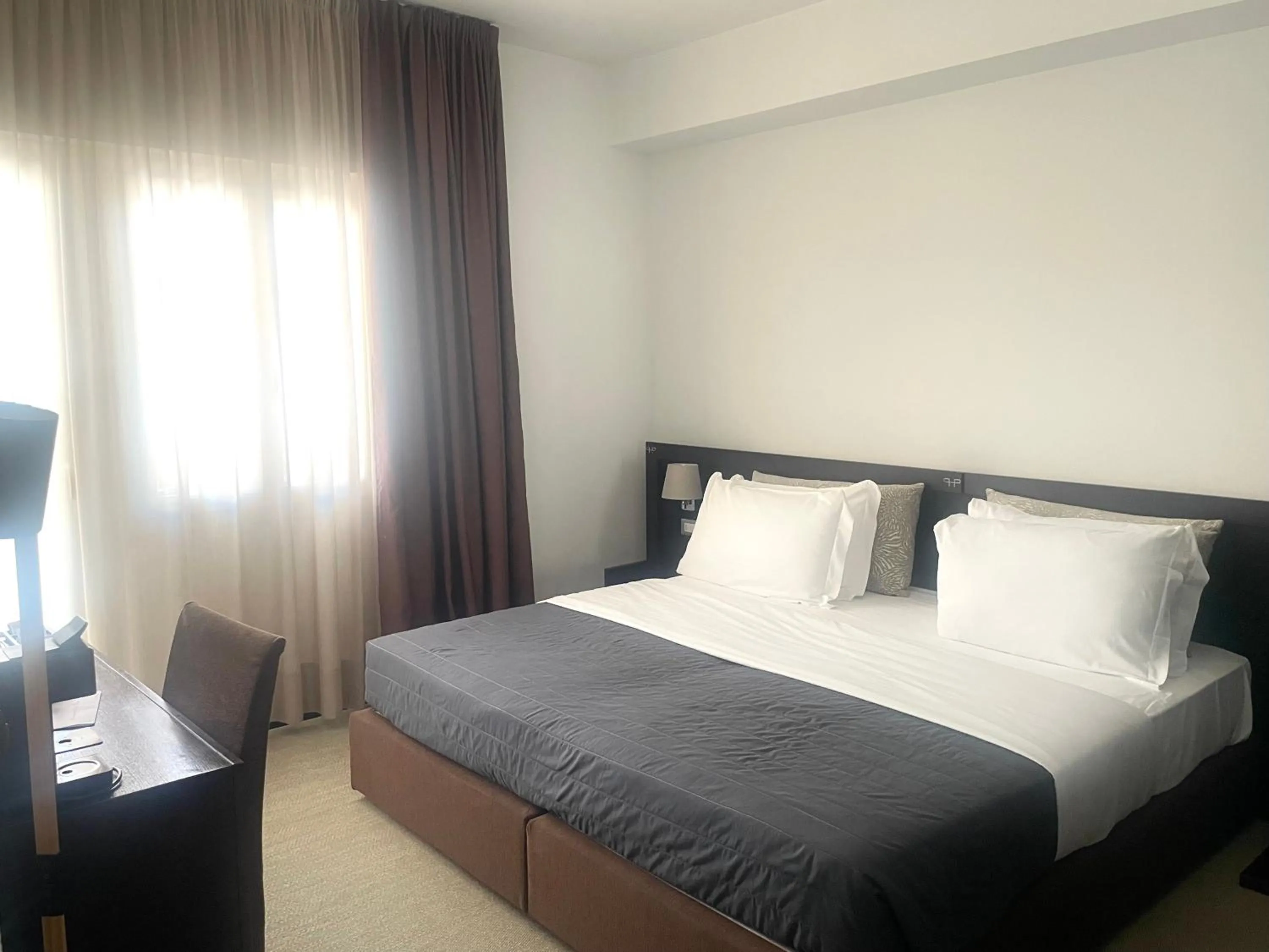 Bed in Hotel Petit Palais