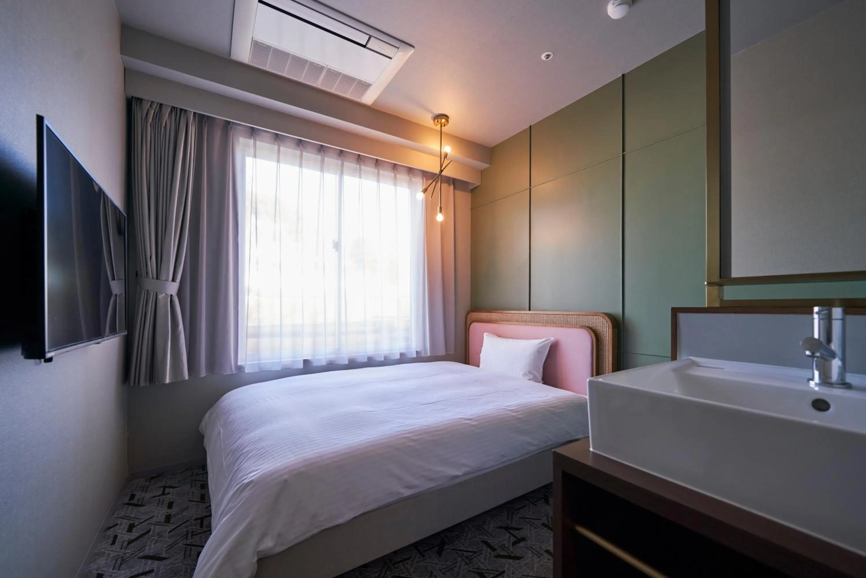 Bed in Mito Sannomaru Hotel