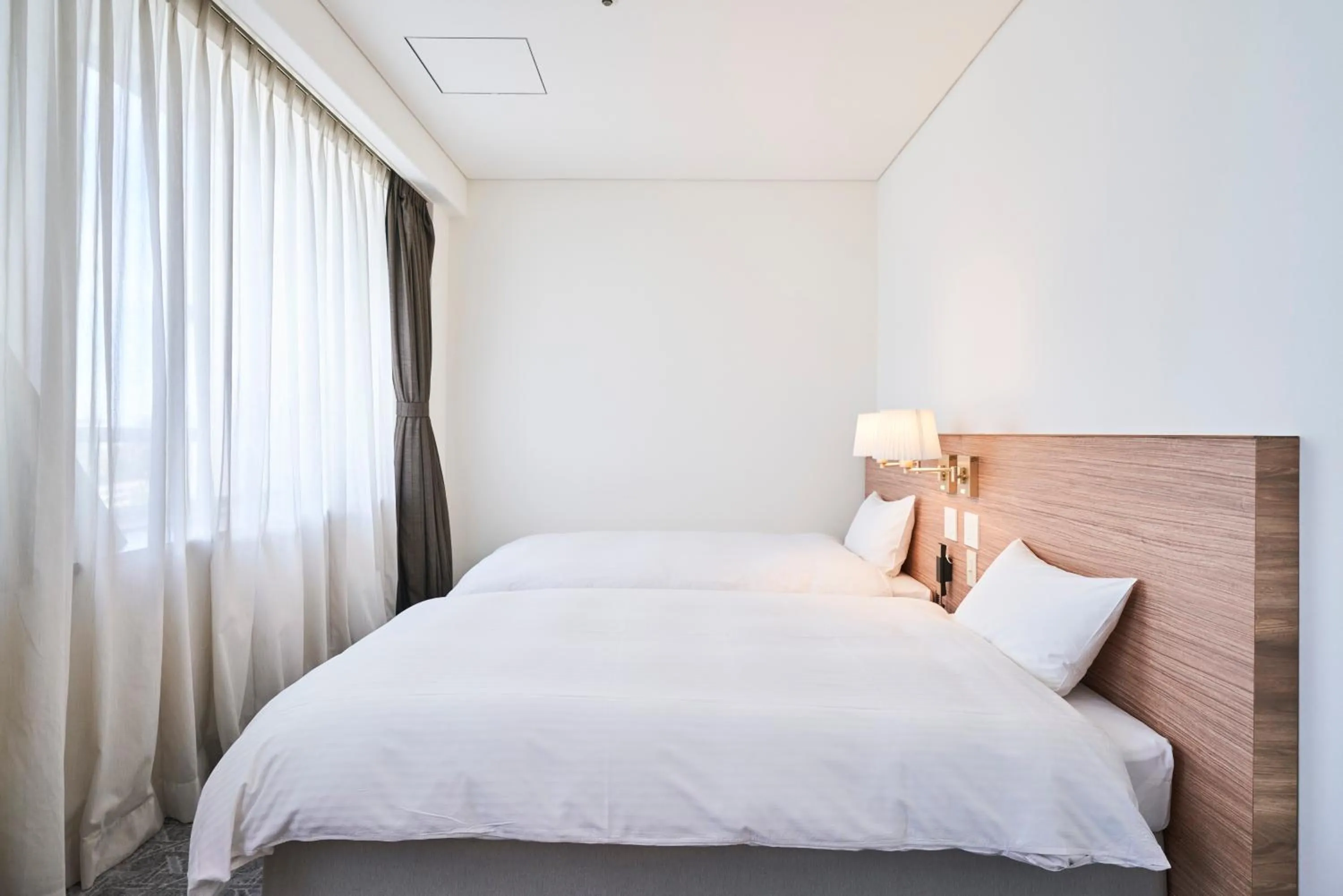 Bed in Mito Sannomaru Hotel