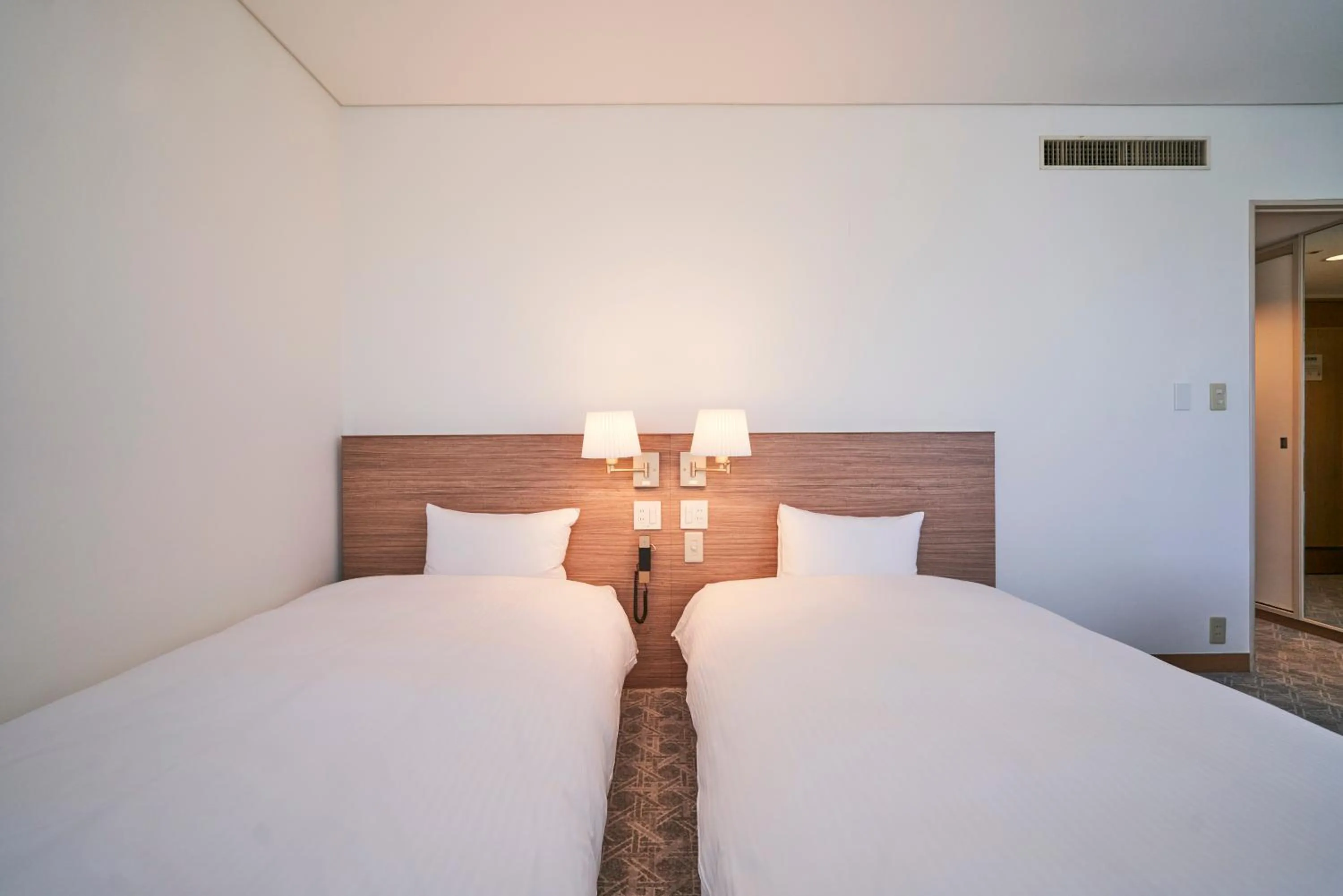 Bed in Mito Sannomaru Hotel