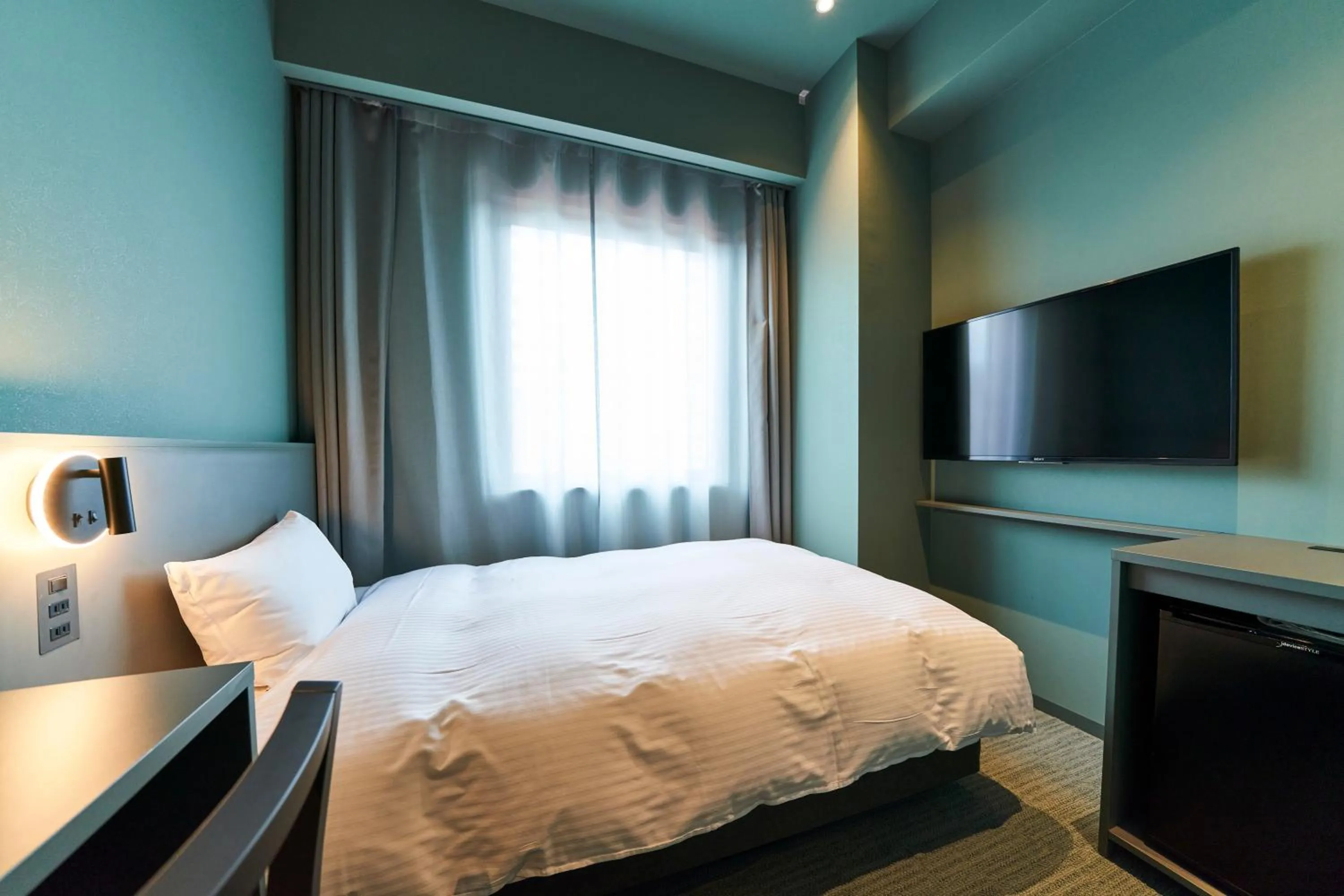 Bed in Saitama Grand Hotel Fukaya