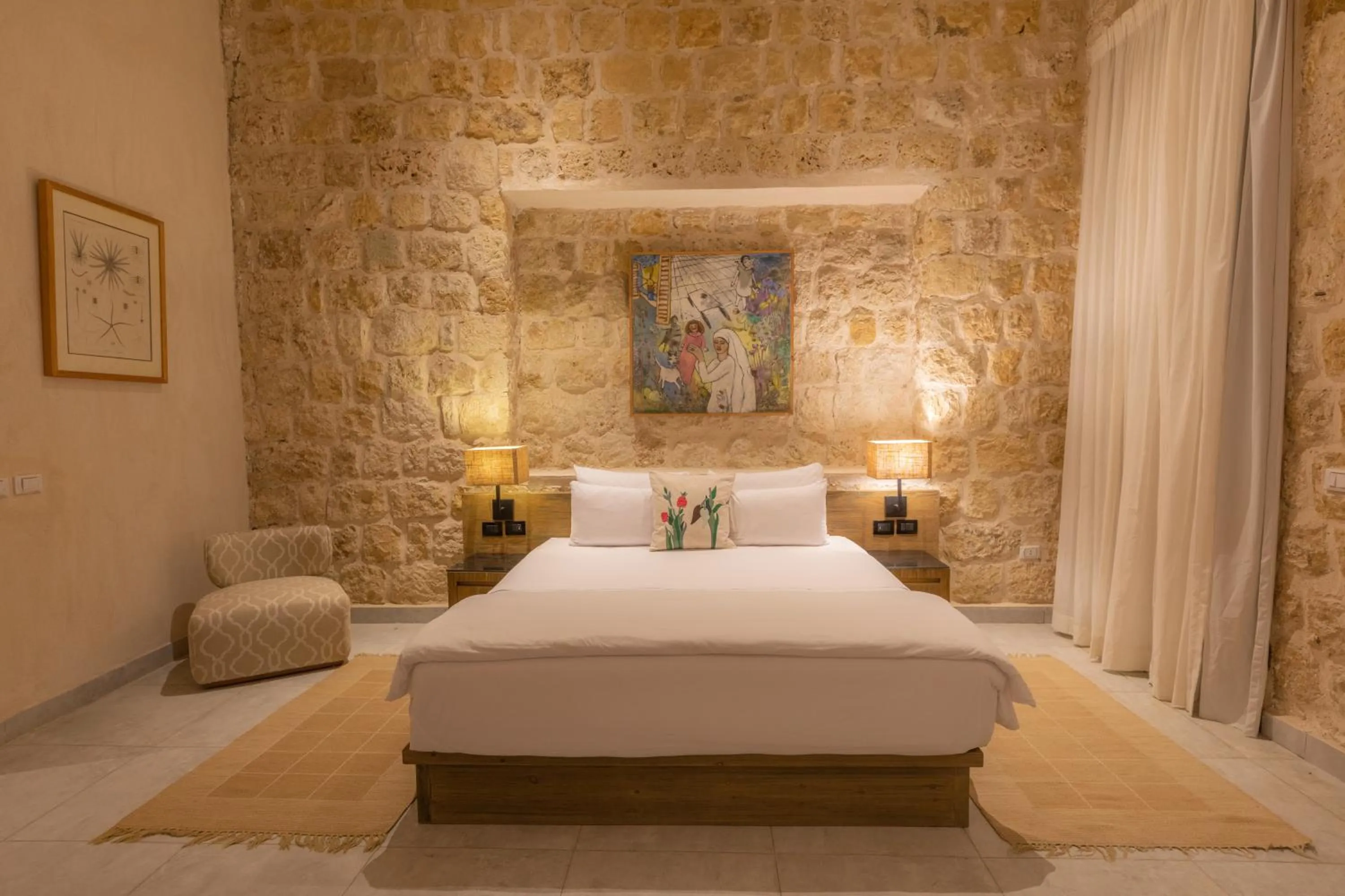 Bed in Wadi Sabarah Lodge
