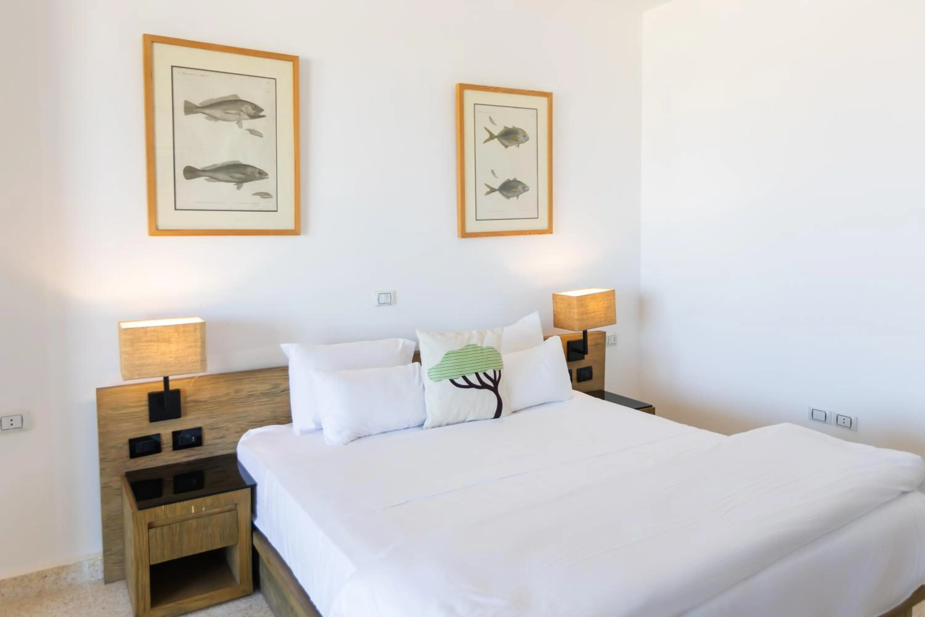 Bed in Wadi Sabarah Lodge