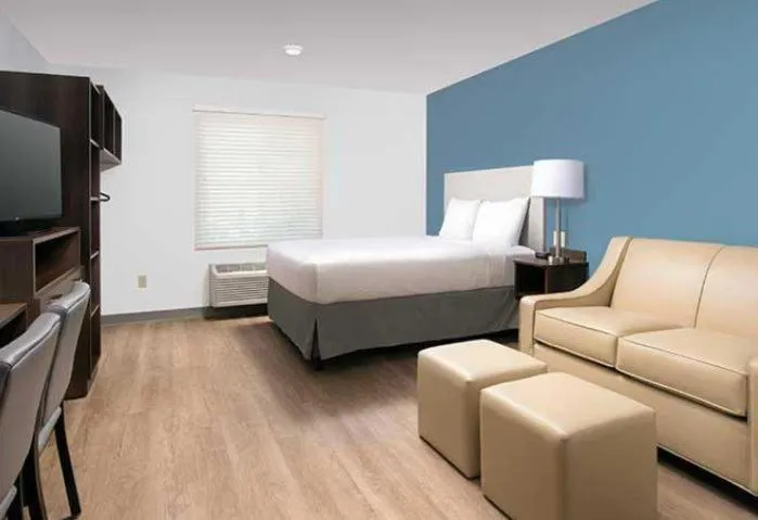Bed in WoodSpring Suites Littleton-South Denver
