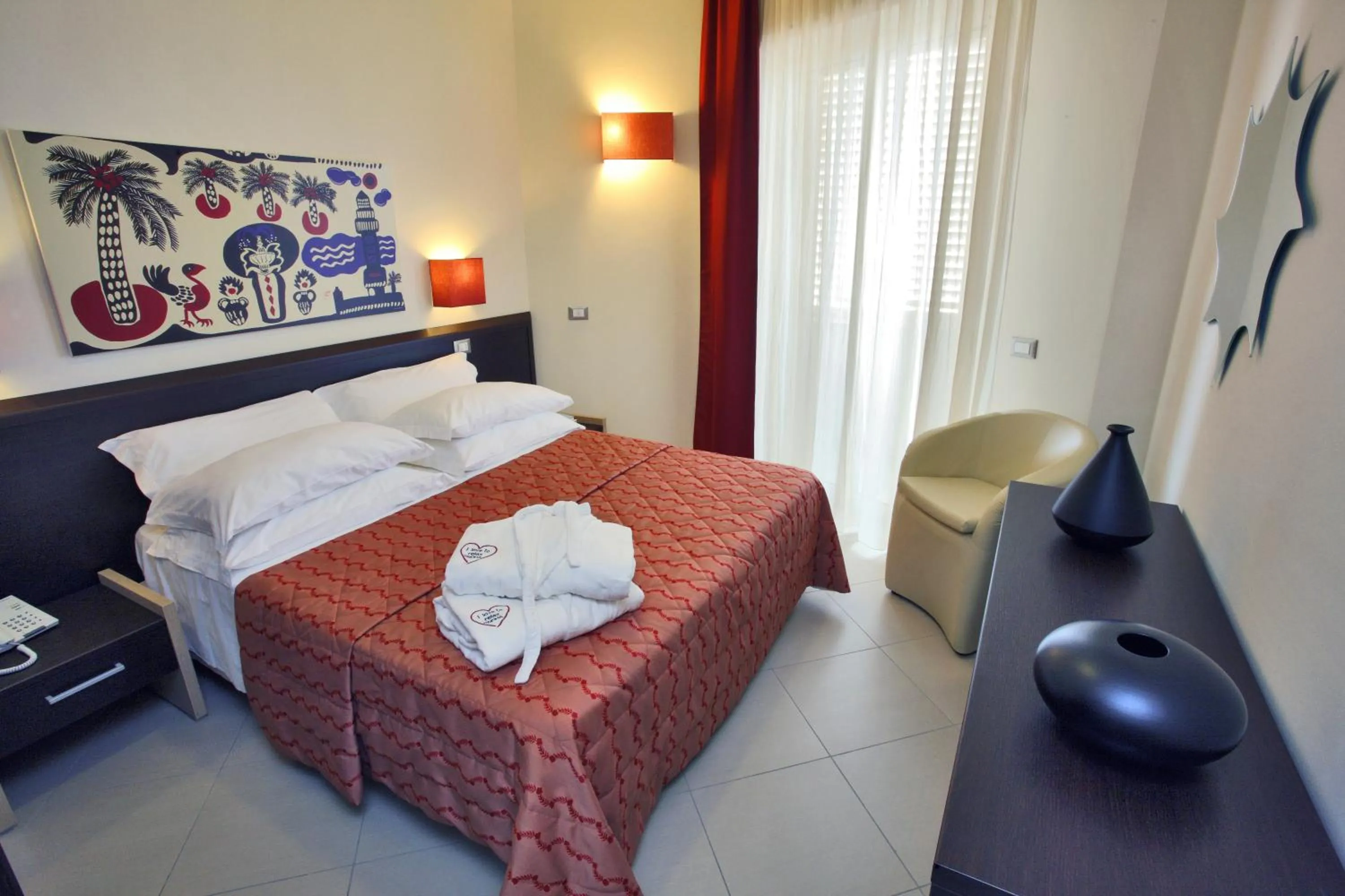 Bed in Noha Suite Hotel