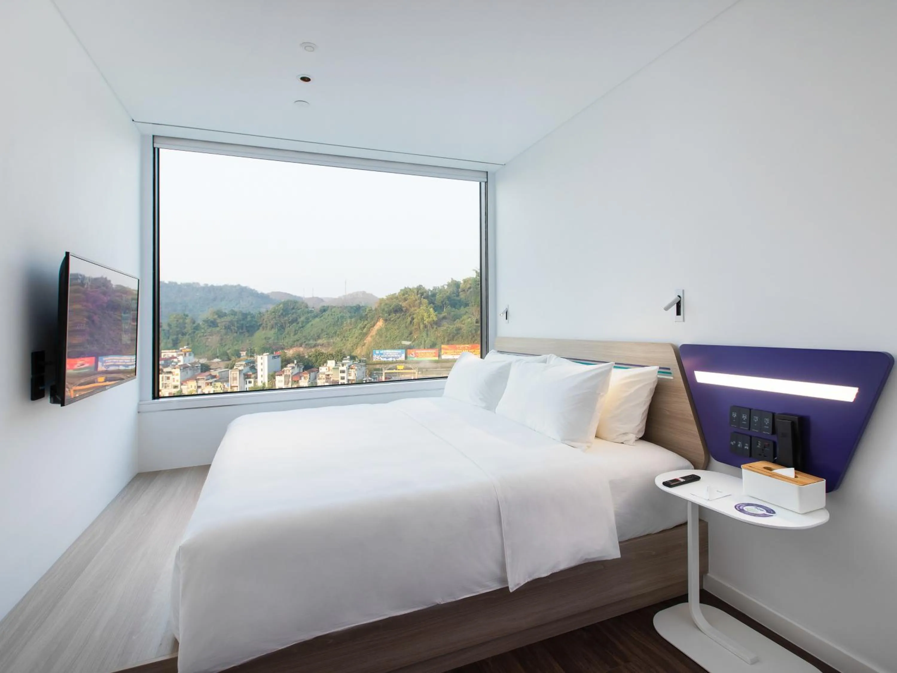 Photo of the whole room, Bed in SOJO Hotel Lao Cai