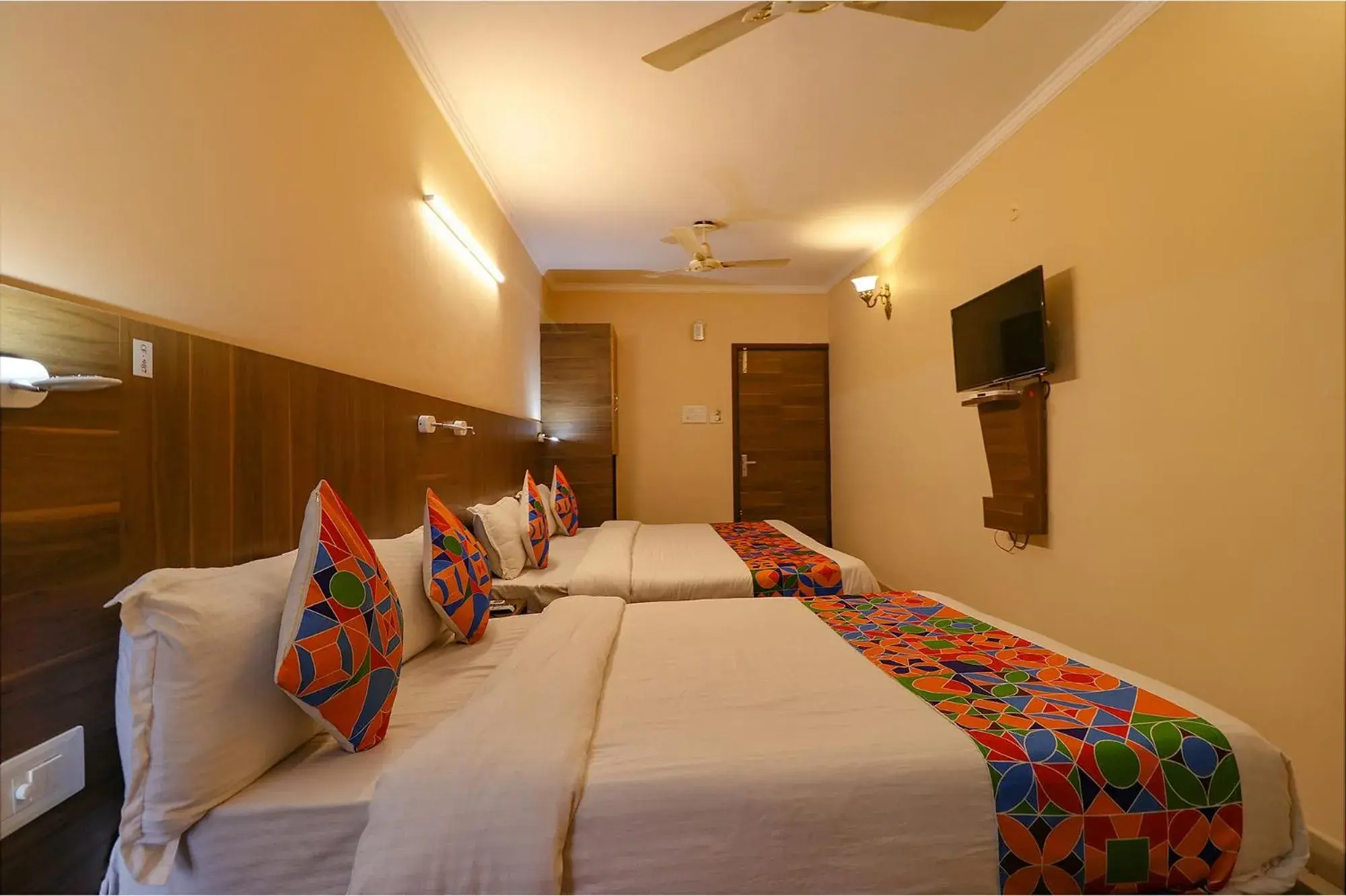 Communal lounge/ TV room, Bed in FabHotel GD Sunrise Inn Amritsar Communal lounge/ TV room, Bed in FabHotel GD Sunrise Inn Amritsar