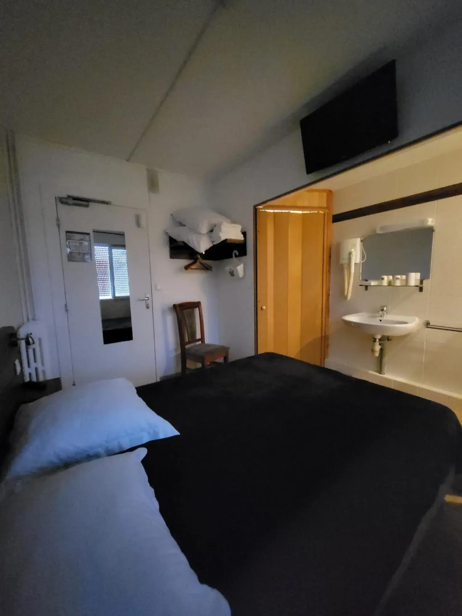 Bedroom in Hotel Les Rosiers Bedroom in Hotel Les Rosiers