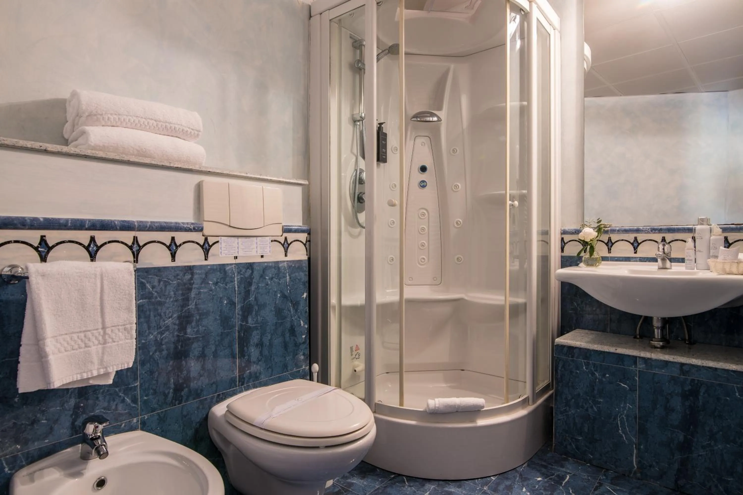 Bathroom in AHG Golf Hotel Porta Del Sole