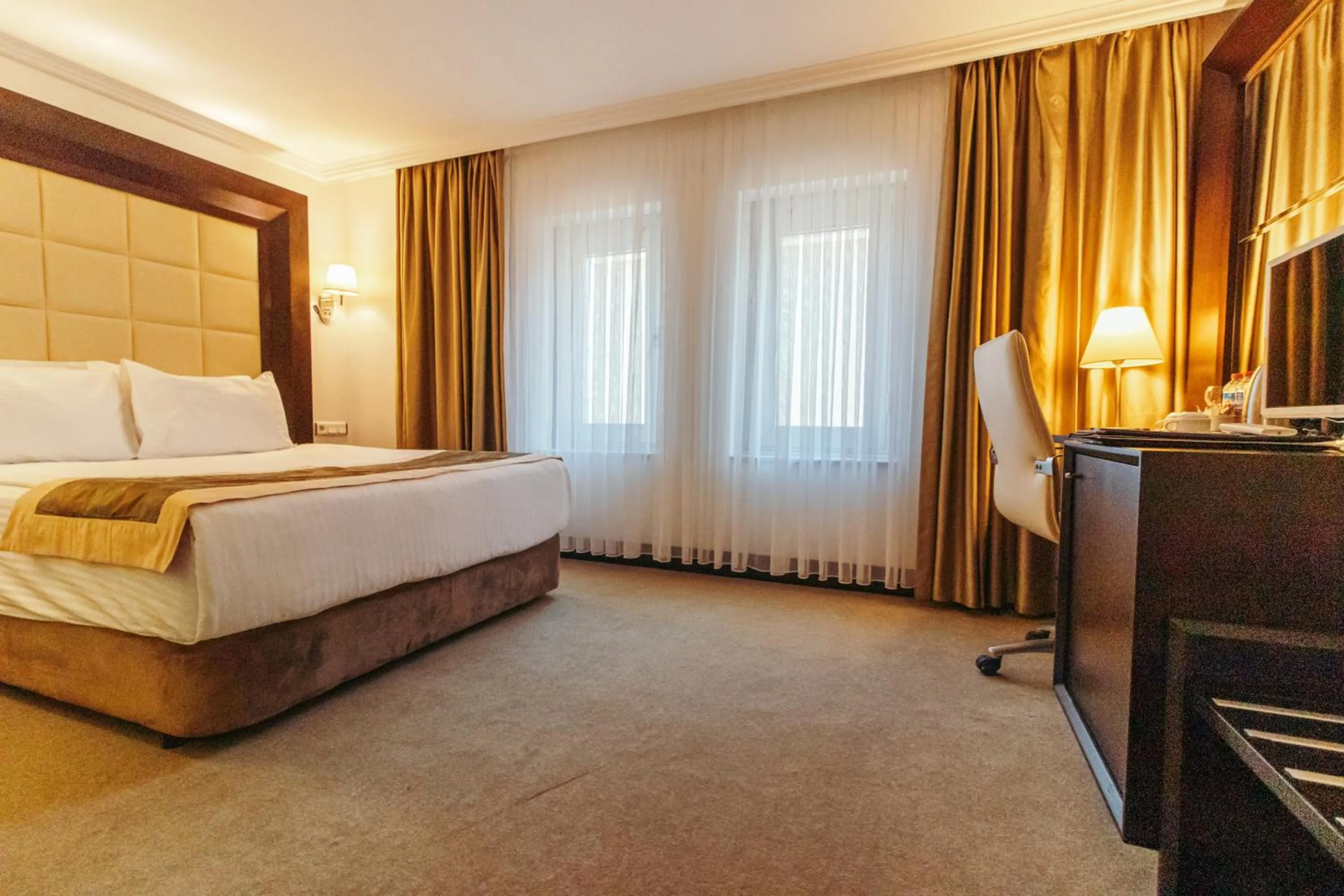 Bed in CK Farabi Hotel