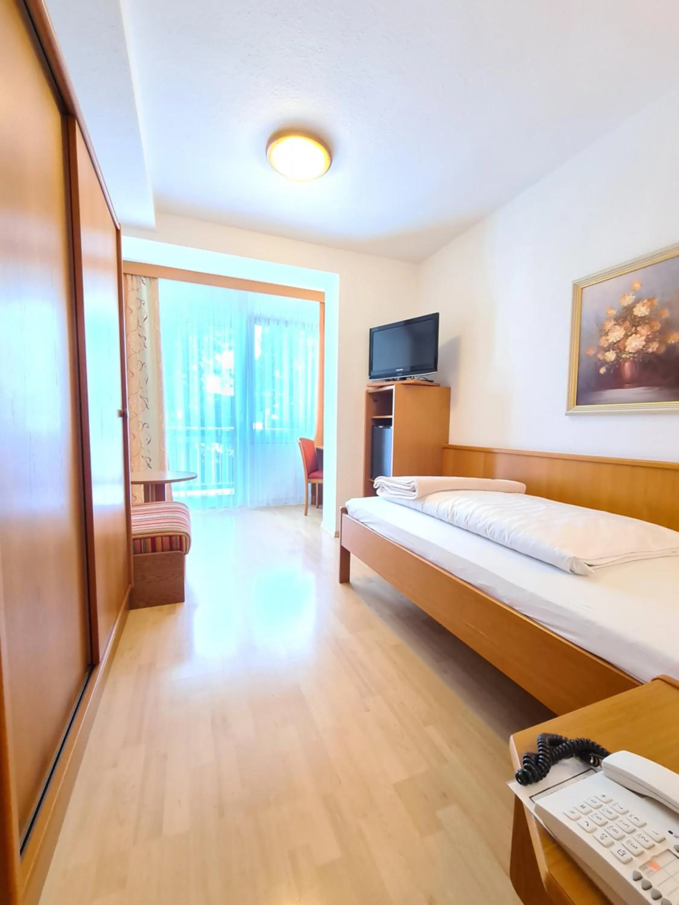 Photo of the whole room, Bed in Thermenhotel Tannenhof - Ihr Wohlfühl-Hotel