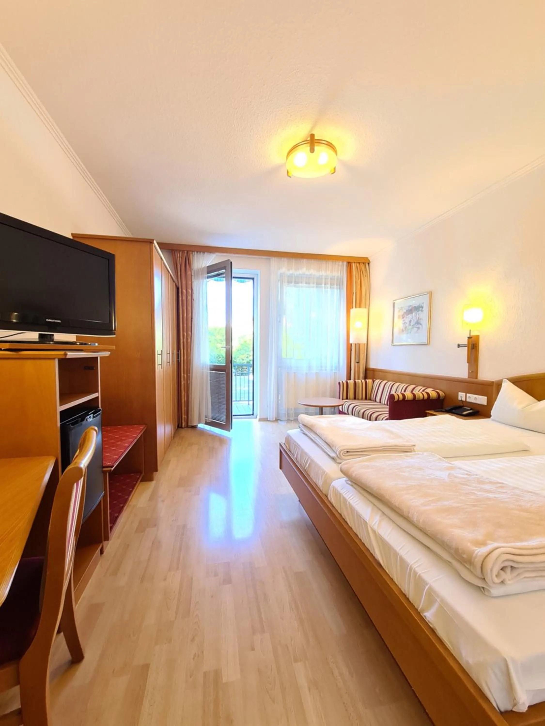 Photo of the whole room, Bed in Thermenhotel Tannenhof - Ihr Wohlfühl-Hotel