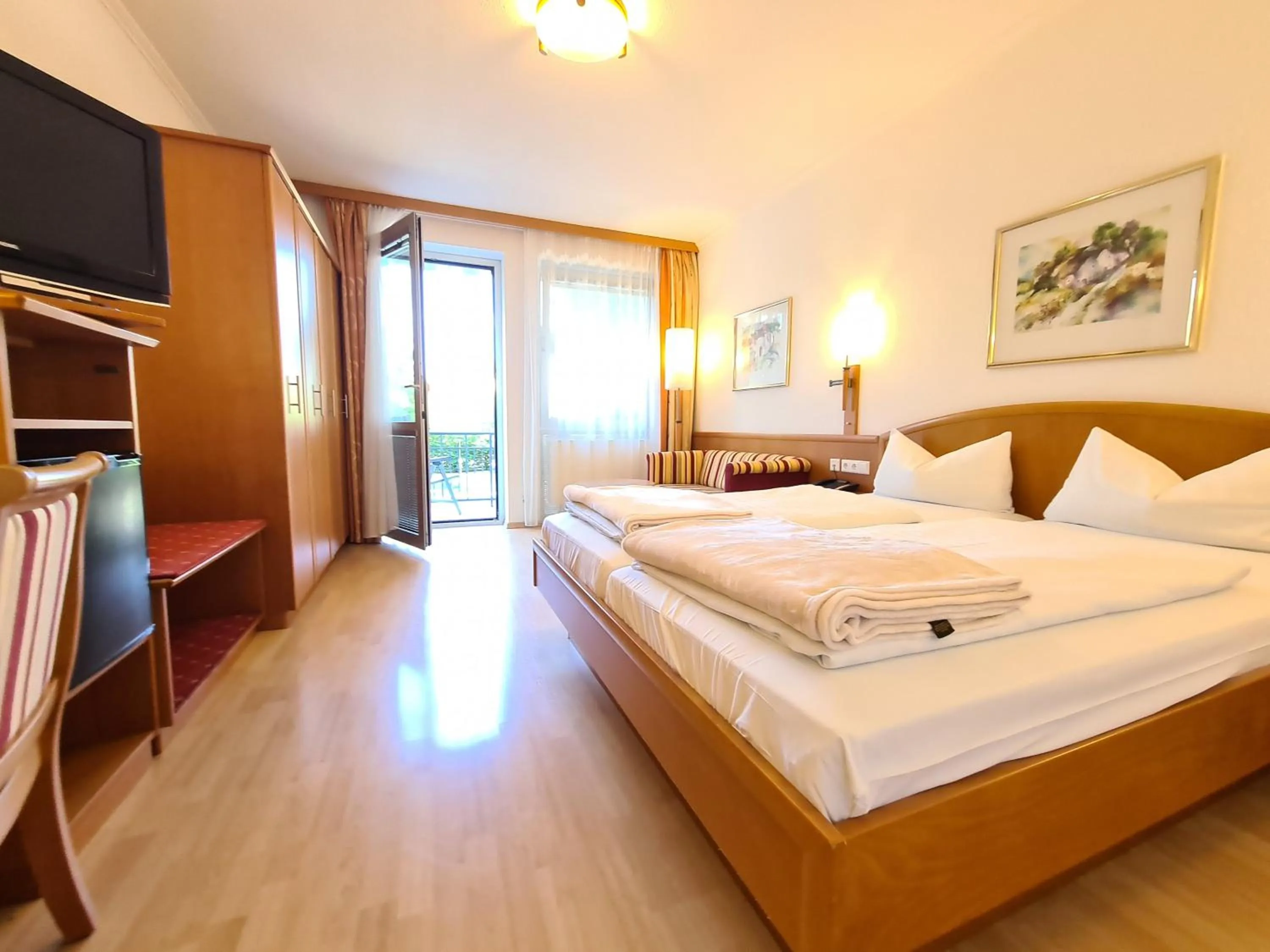 Photo of the whole room, Bed in Thermenhotel Tannenhof - Ihr Wohlfühl-Hotel