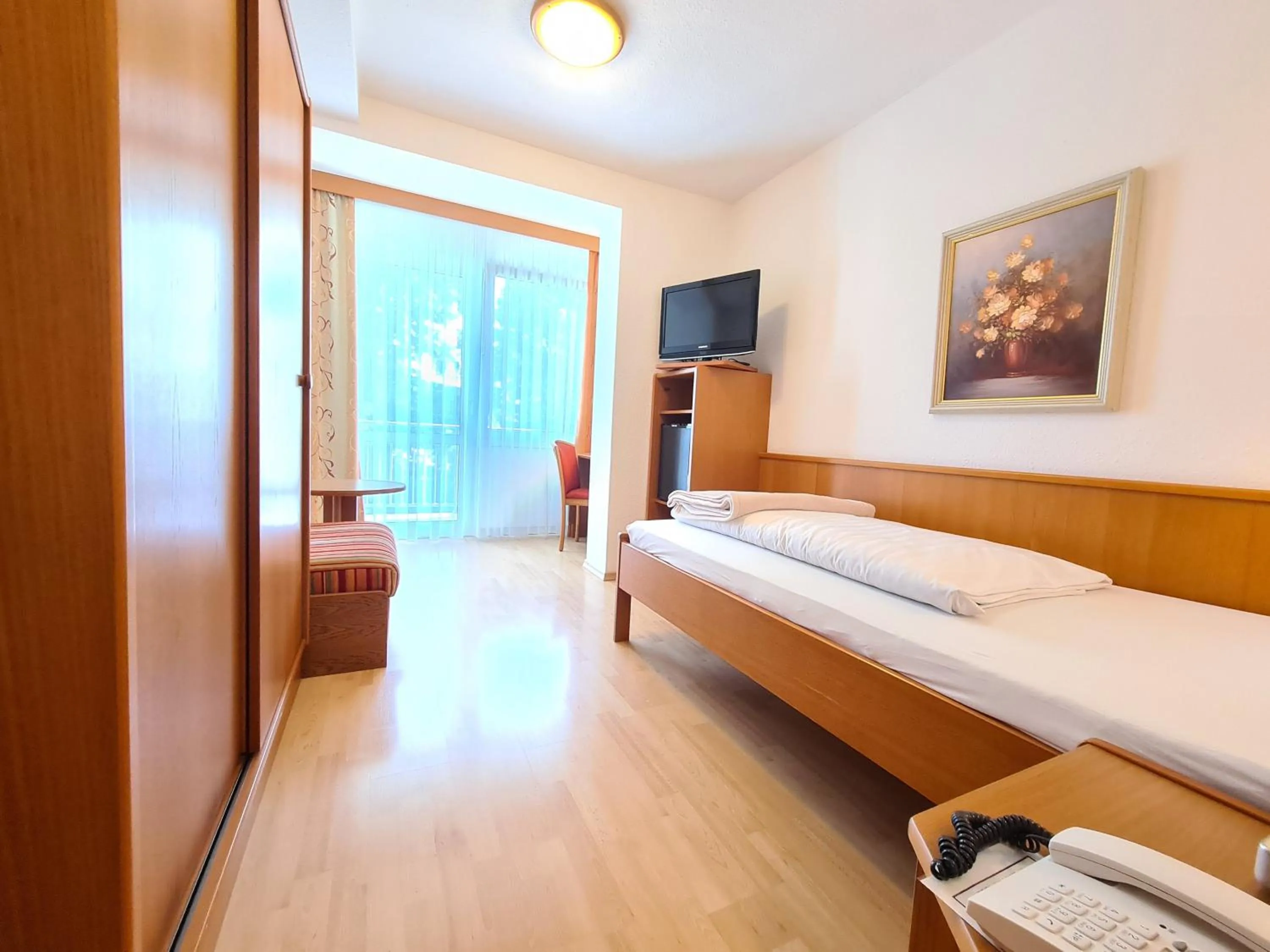 Photo of the whole room, Bed in Thermenhotel Tannenhof - Ihr Wohlfühl-Hotel