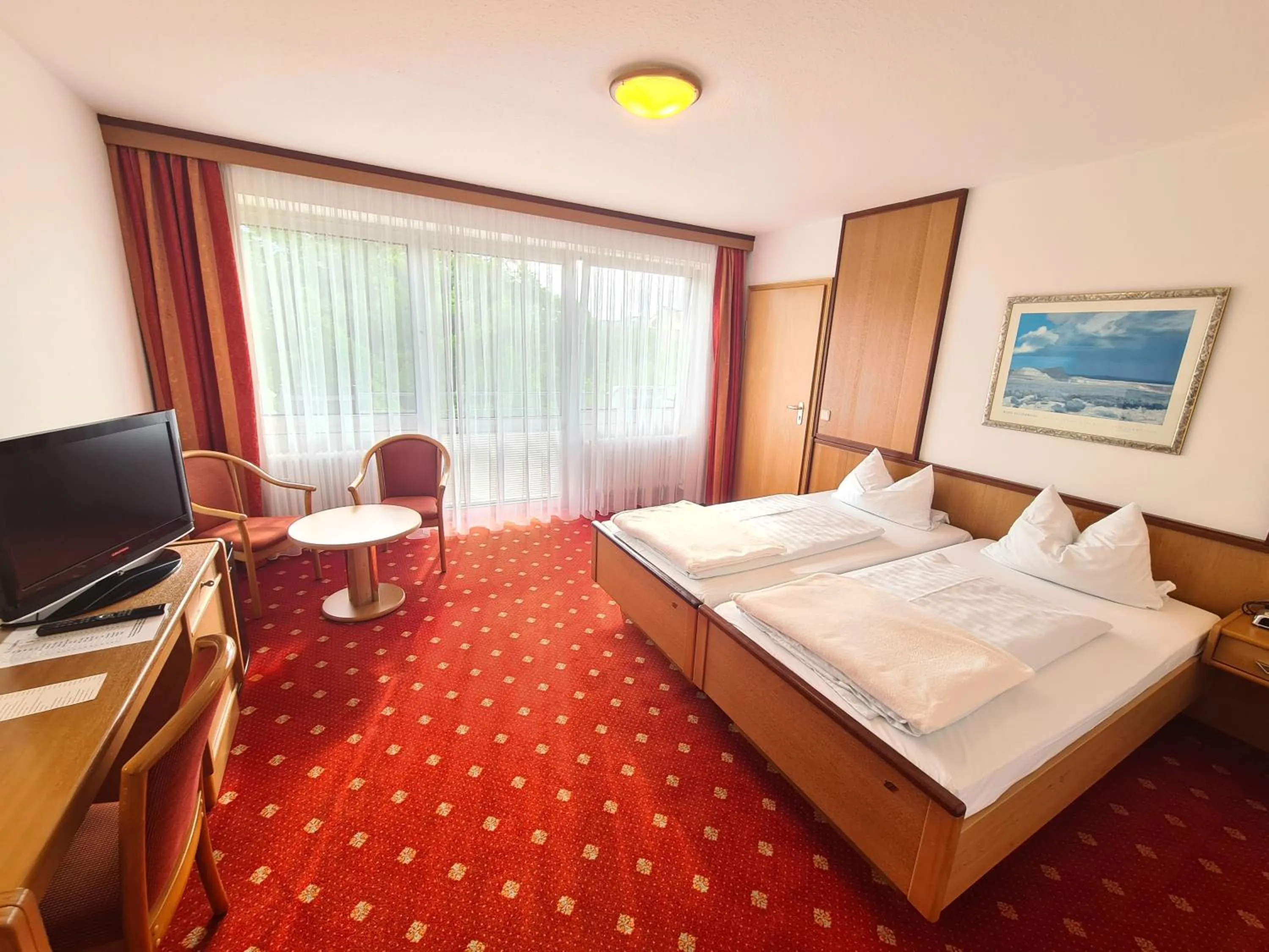 Photo of the whole room, Bed in Thermenhotel Tannenhof - Ihr Wohlfühl-Hotel