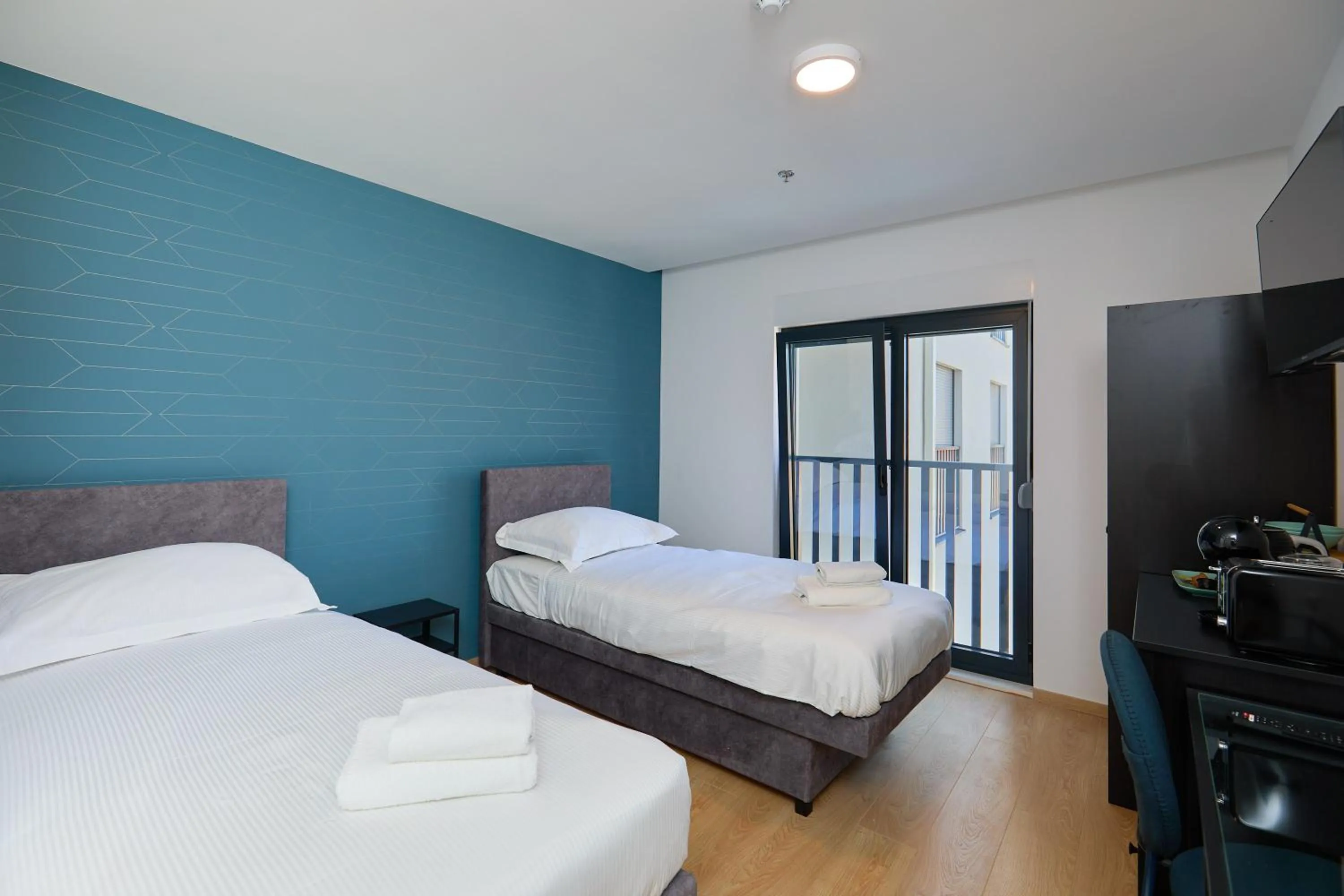 Bed in DOMINIUM CITY SUITES