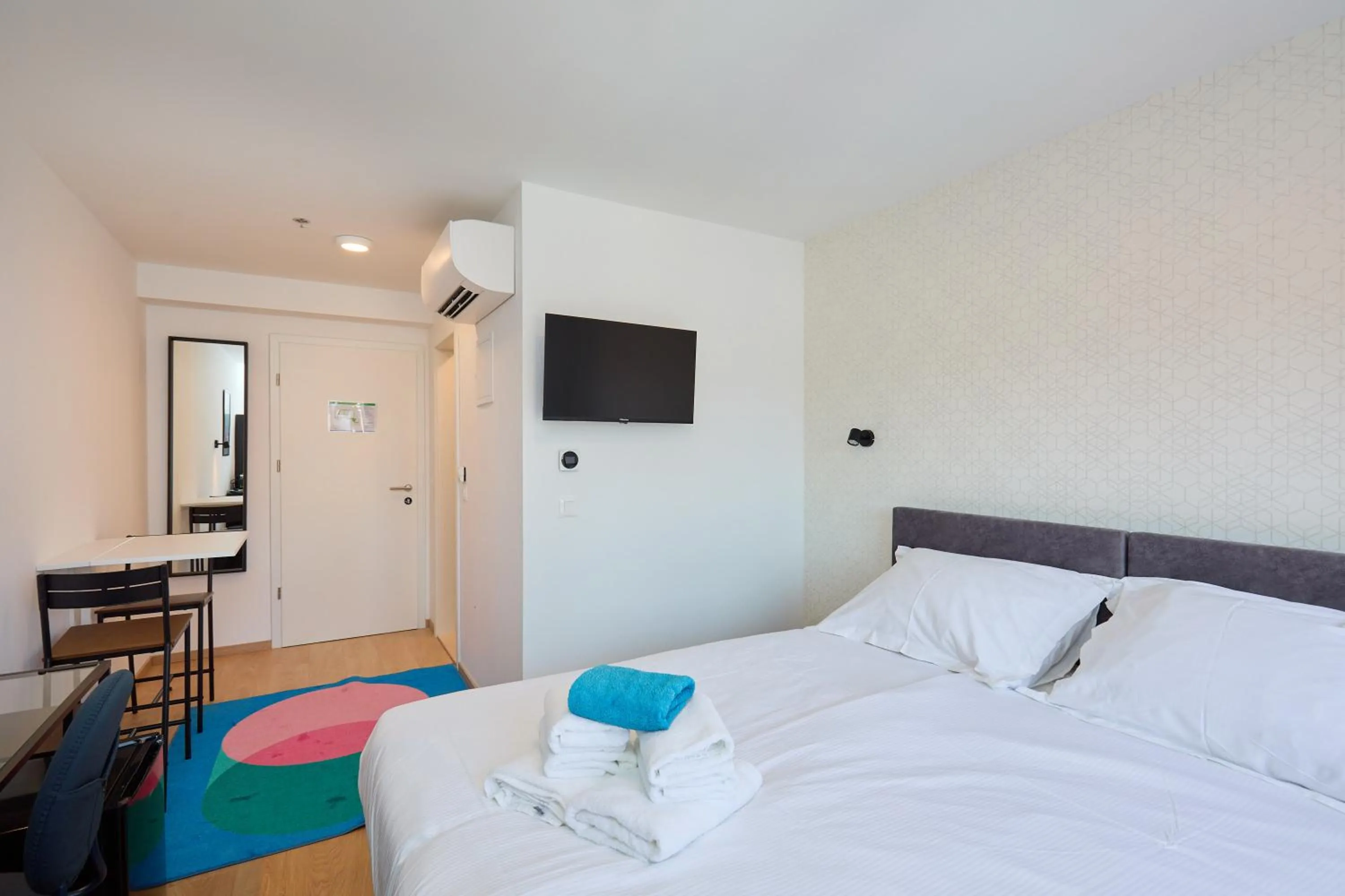 Bed in DOMINIUM CITY SUITES