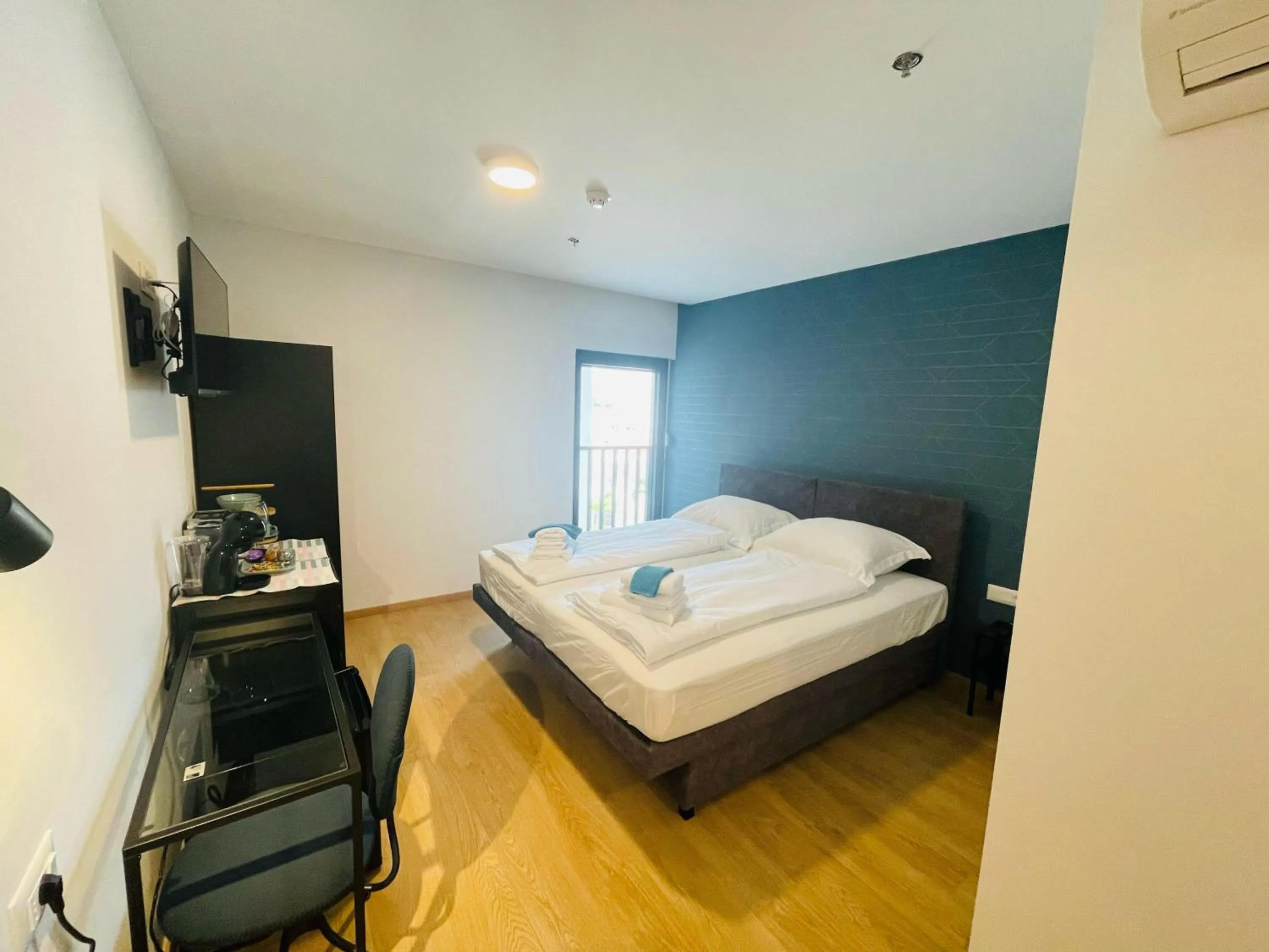 Bed in DOMINIUM CITY SUITES