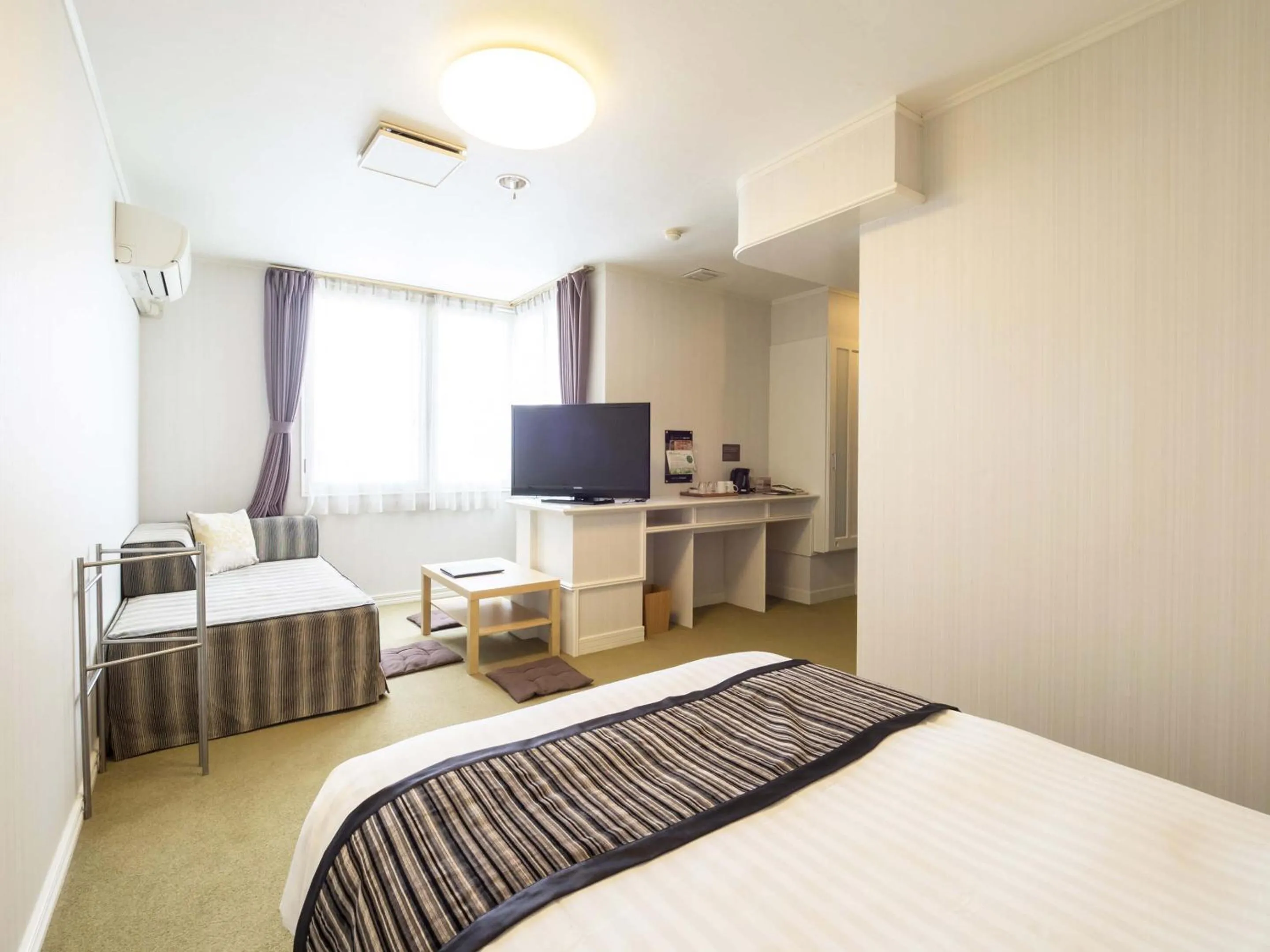 Photo of the whole room, Bed in Hotel AreaOne Obihiro