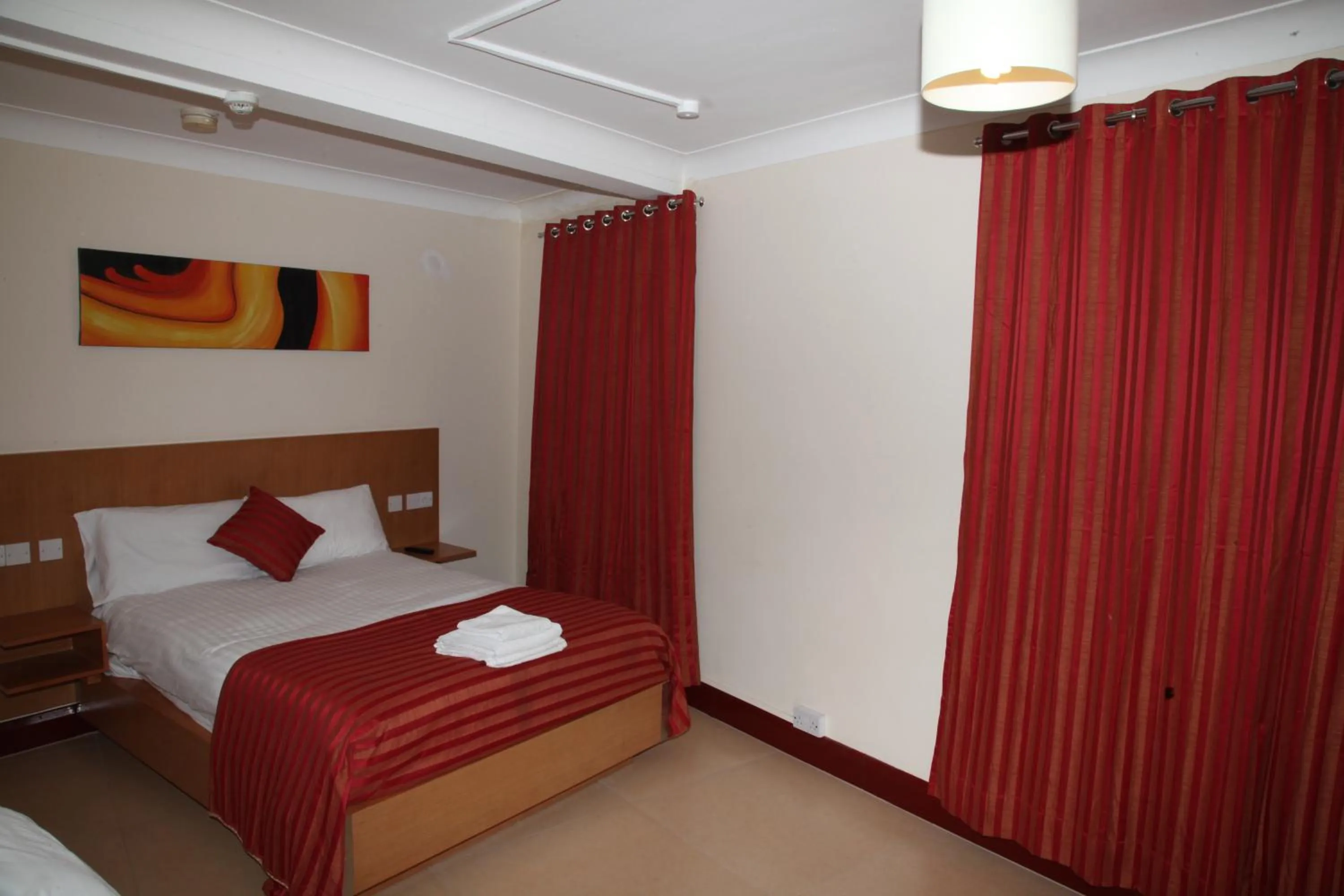 Photo of the whole room, Bed in Grove Apartments