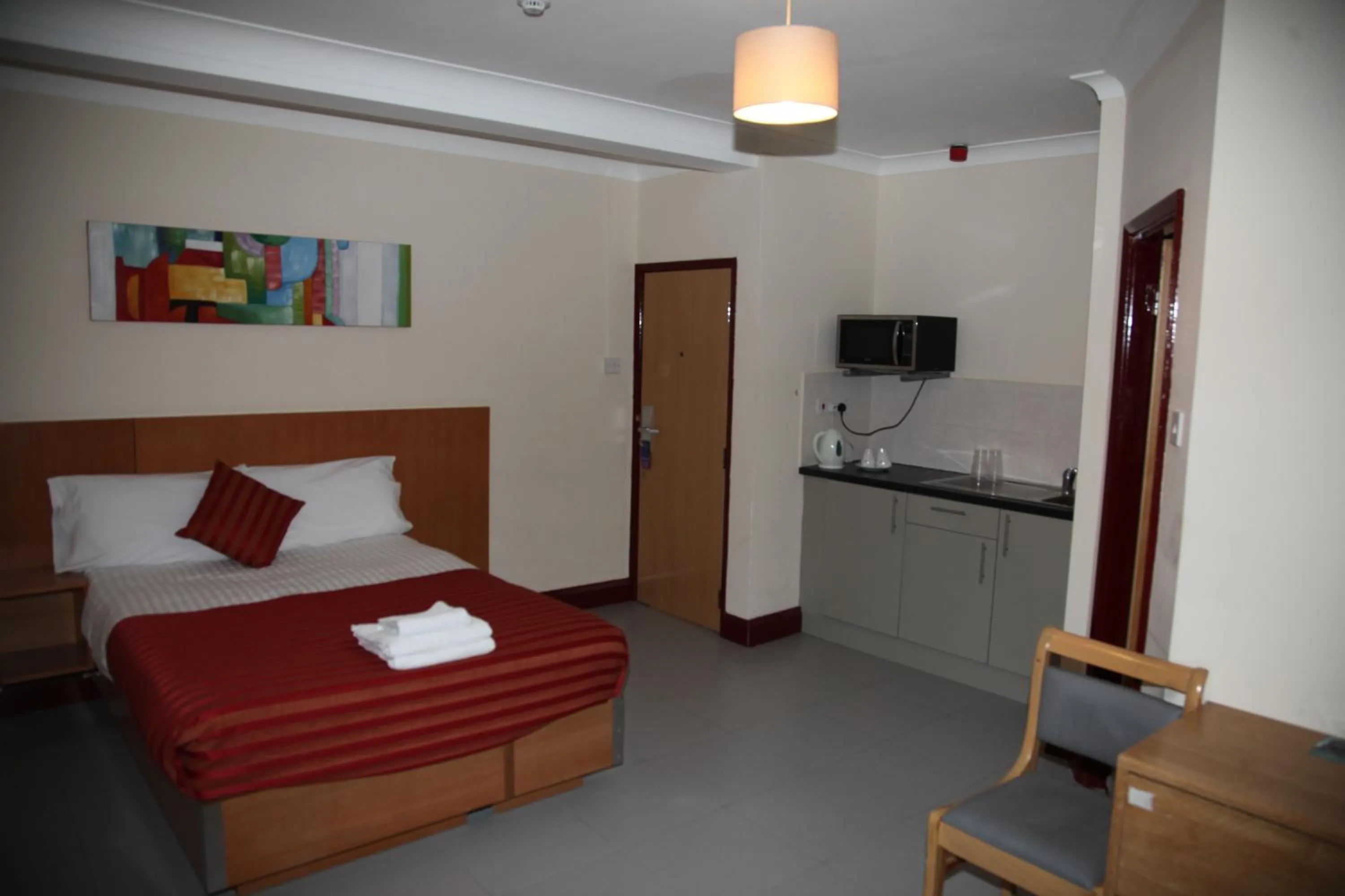 Photo of the whole room, Bed in Grove Apartments