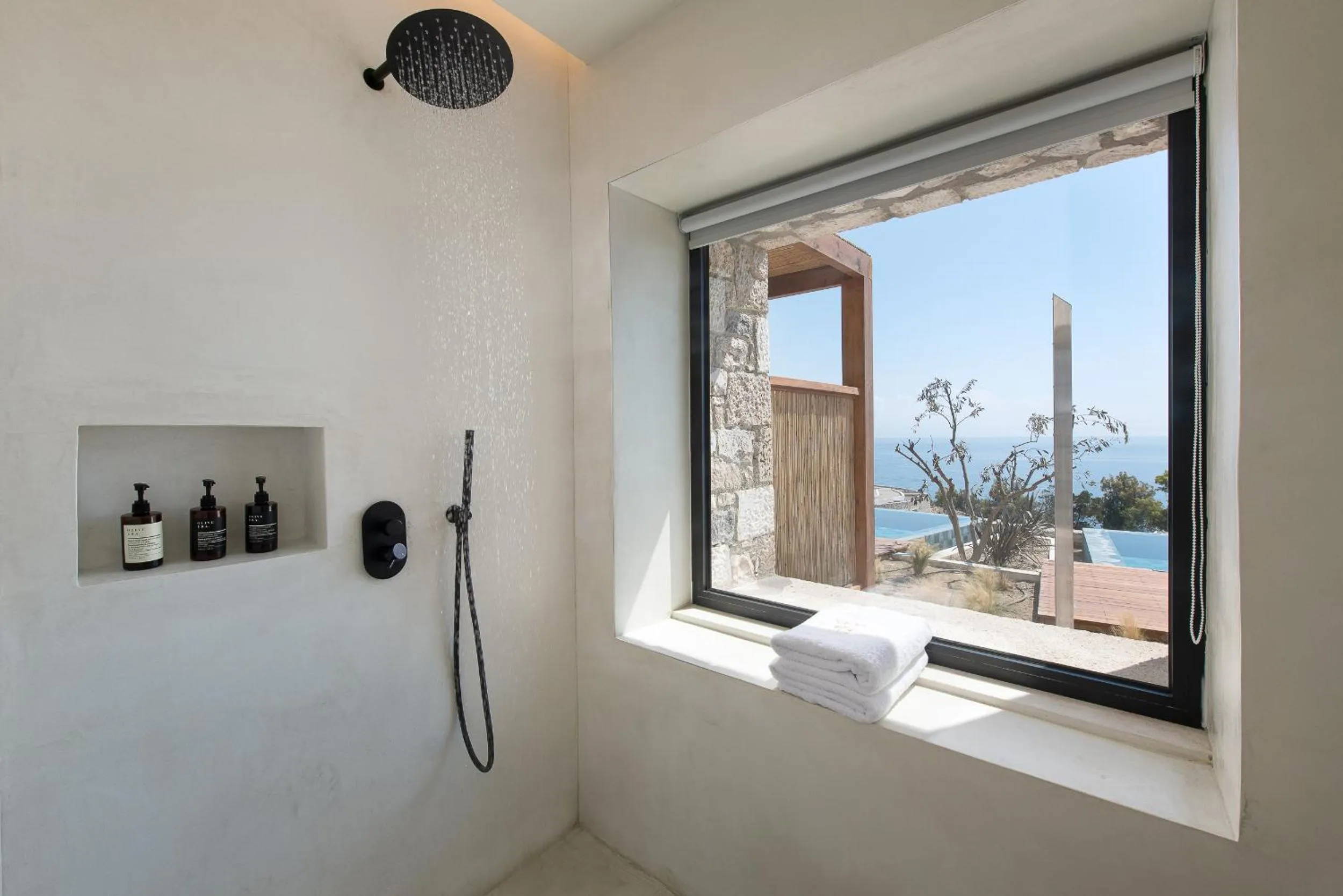 Shower in KOIA All - Suite Well Being Resort - Adults Only